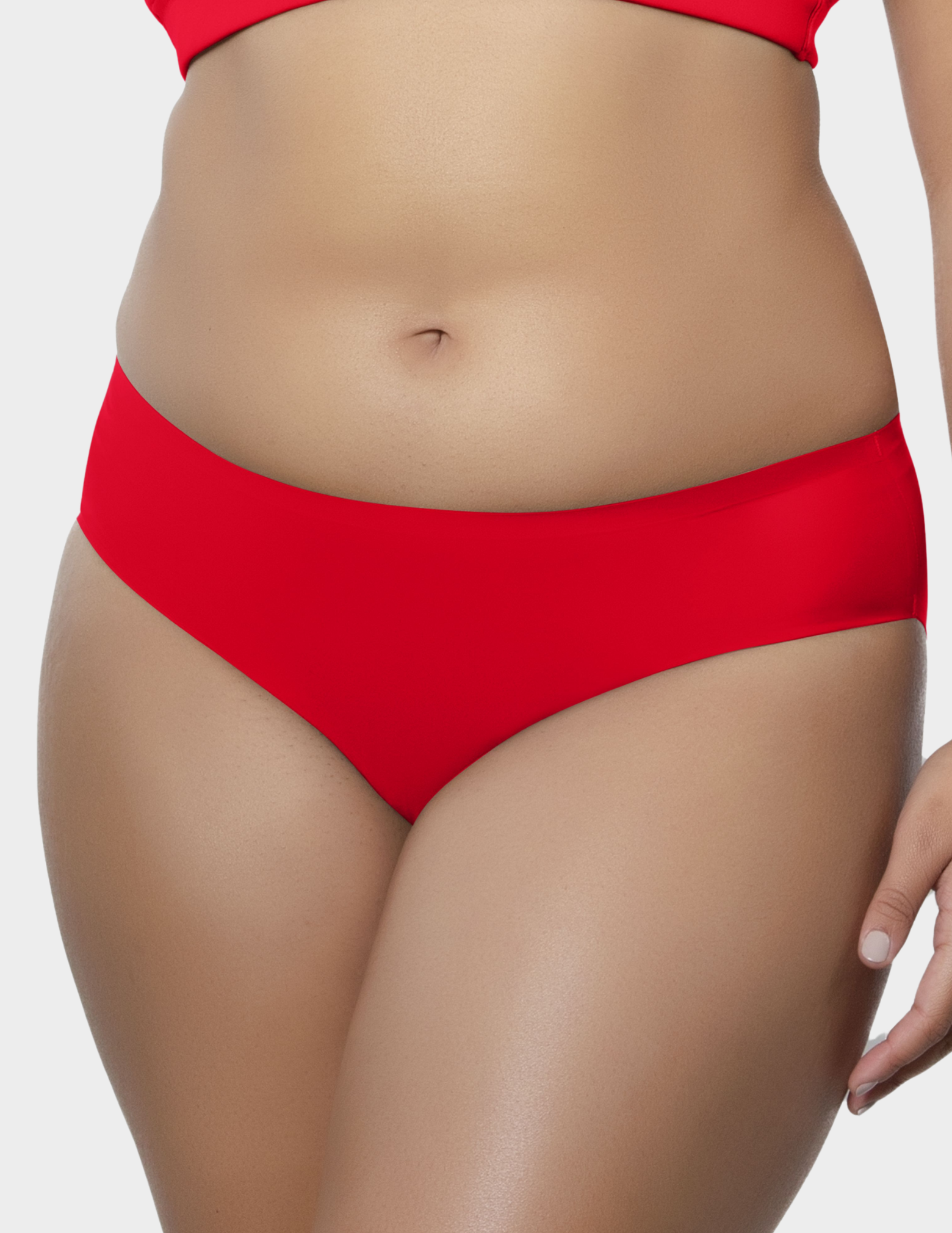 Front view of a model wearing Parfait Bonded hipster panty in racing red