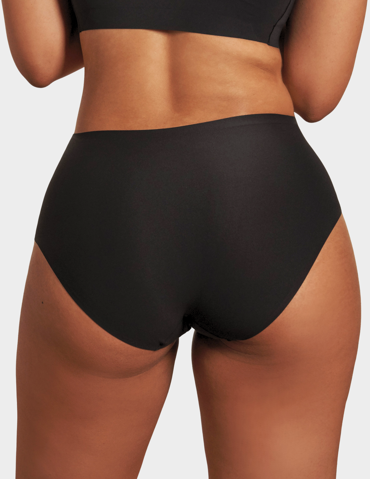 Back view of a model wearing Evelyn & Bobbie high waist brief in Black