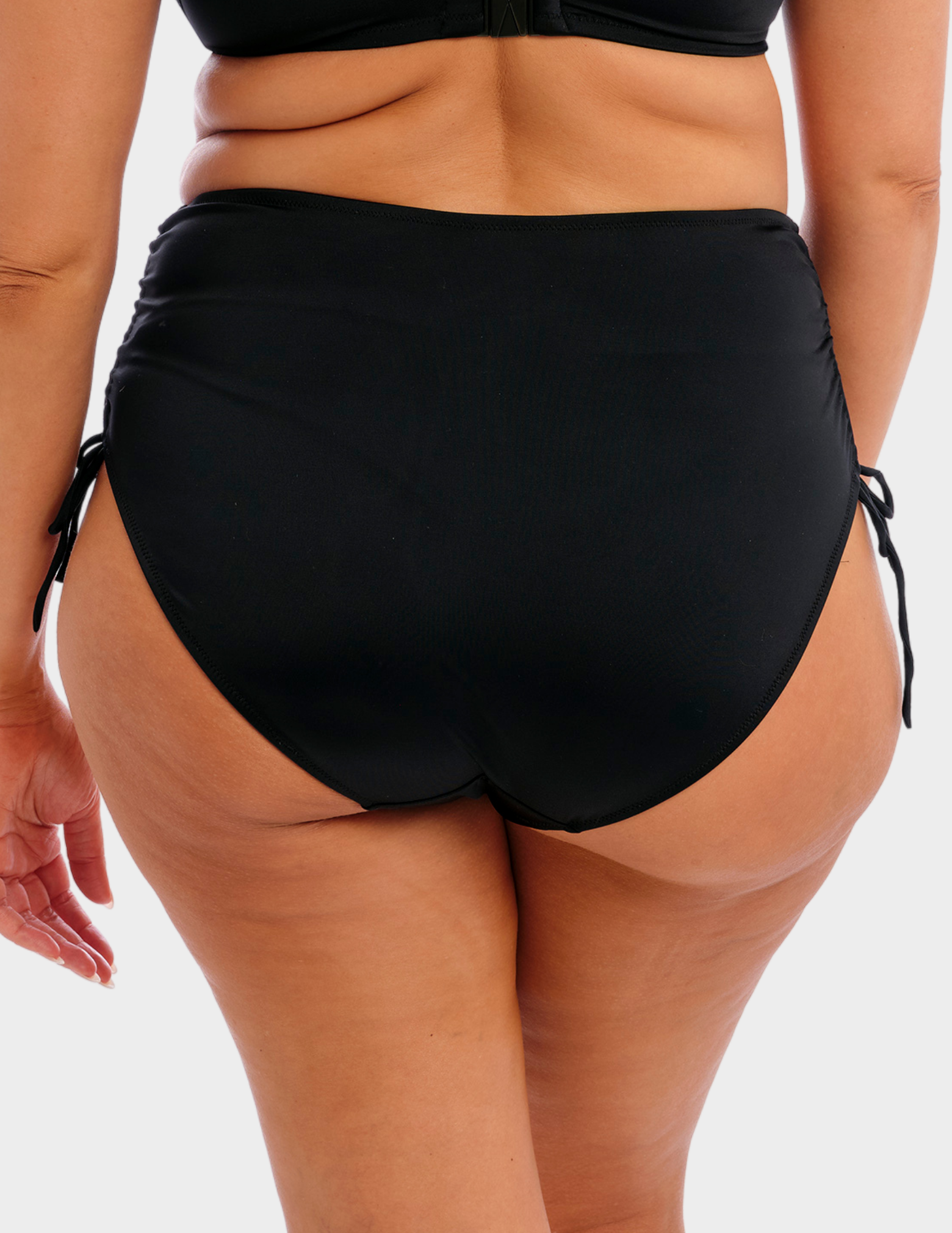 Back view of a model wearing Elomi Plain Sailing swim brief in black
