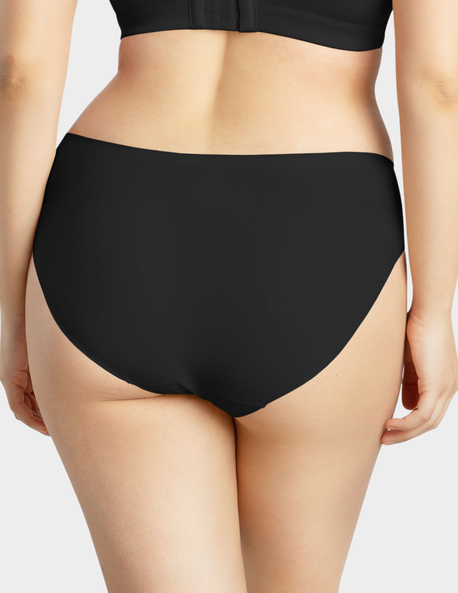 Back view of a model wearing Parfait Bonded hipster panty in mid nude