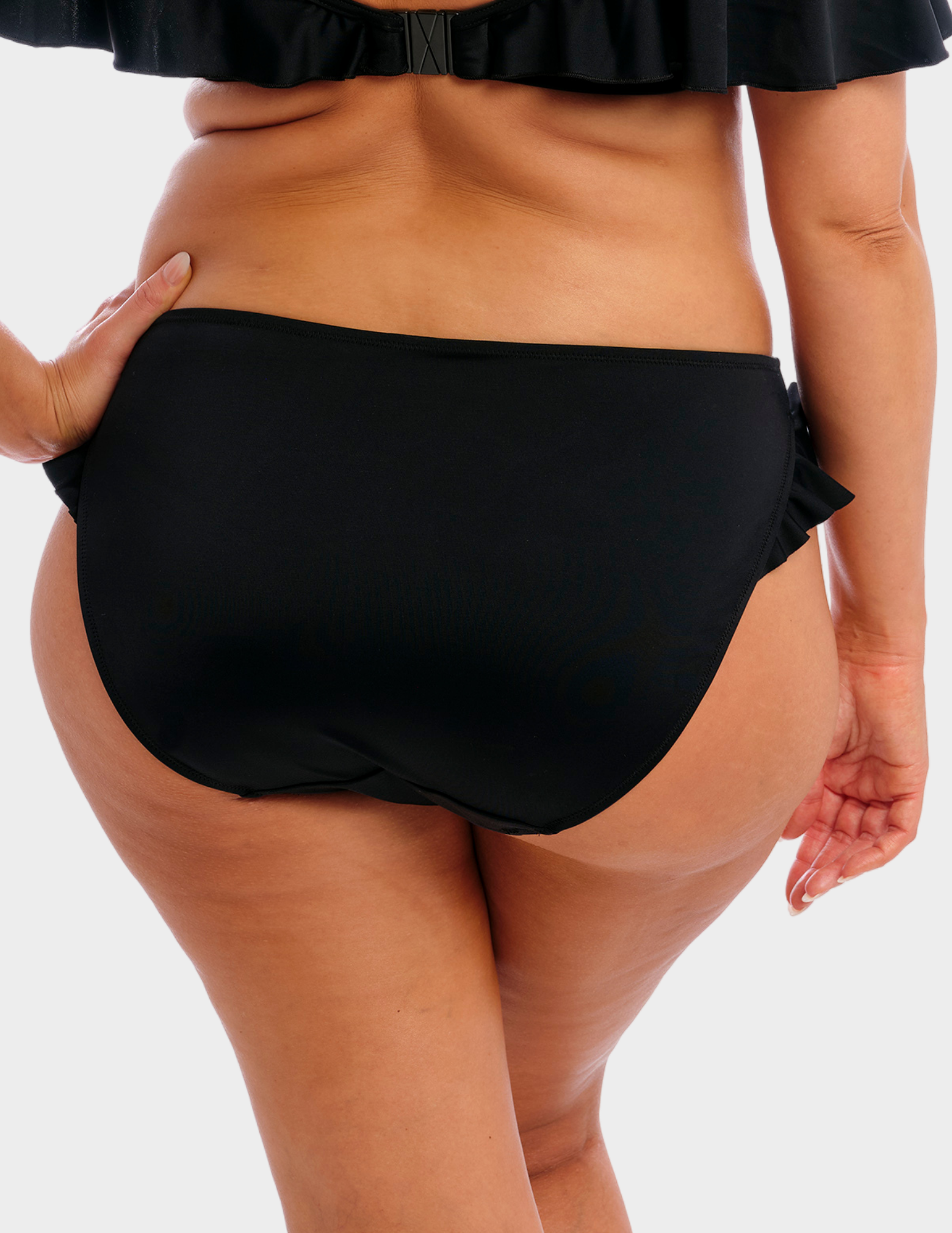 Back view of a model wearing Elomi Plain Sailing swim brief in black
