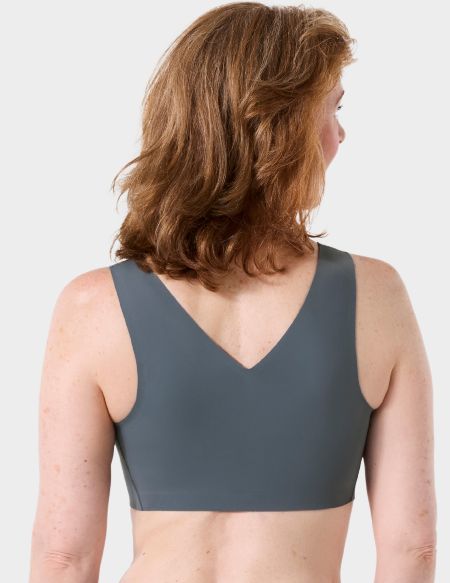 Back view of a model wearing Evelyn & Bobbie Defy bra in Slate Grey