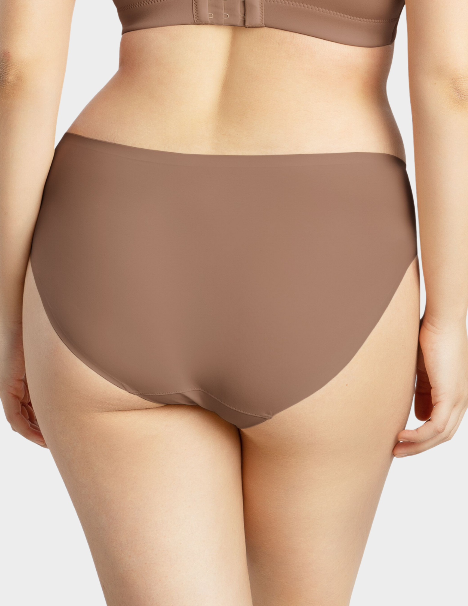 Back view of a model wearing Parfait Bonded hipster panty in mid nude