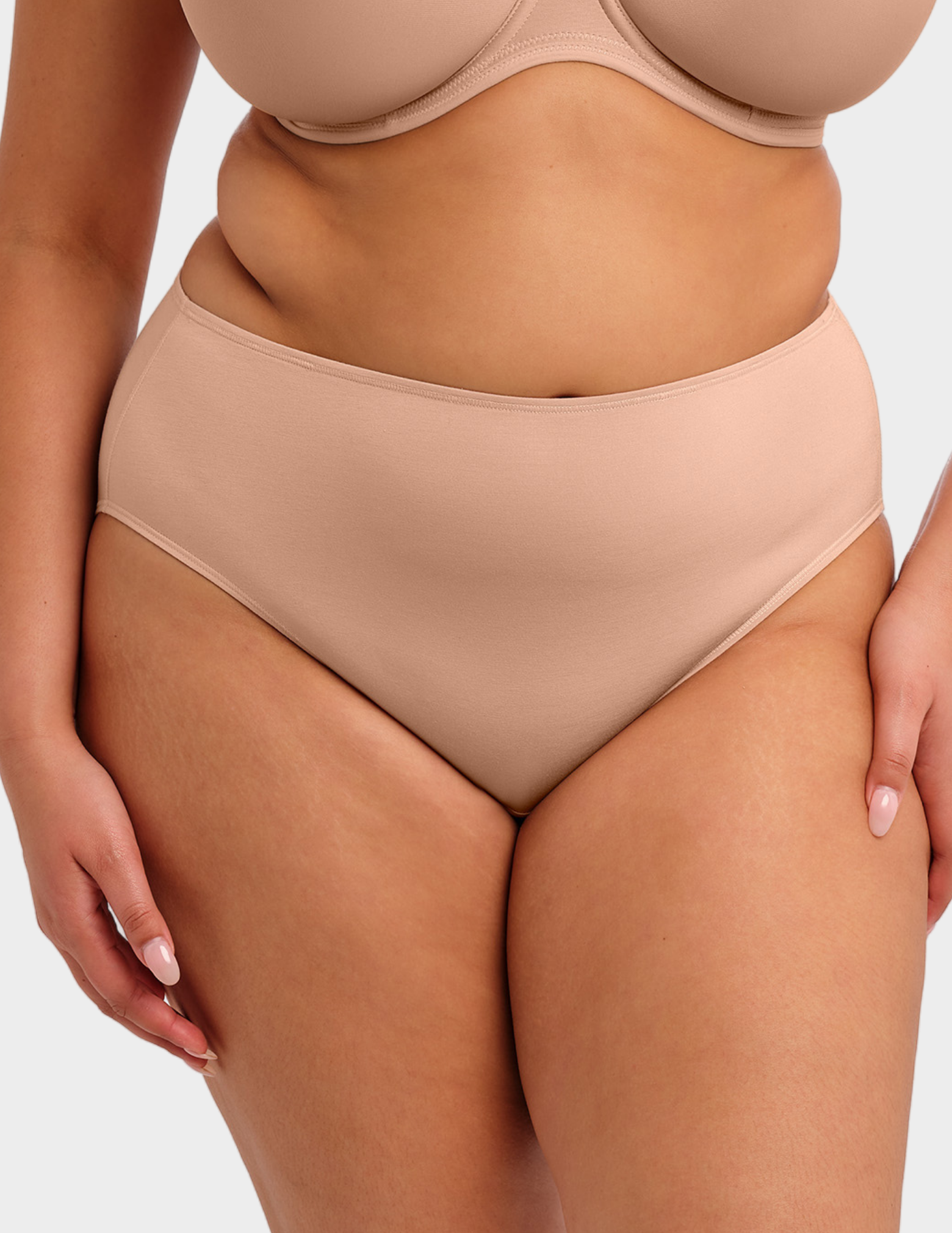 Front view of a model wearing Elomi Smooth brief in Sahara