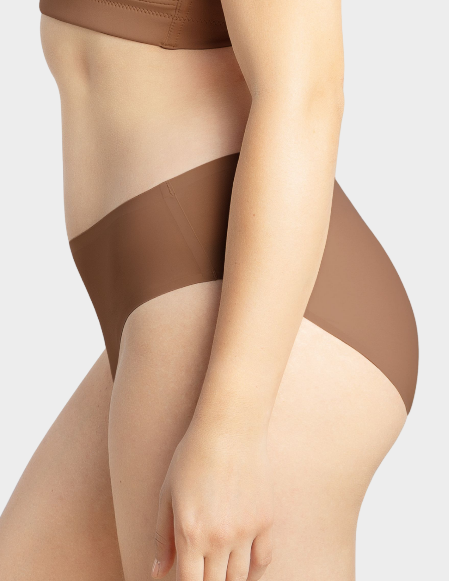 Side view of a model wearing Parfait Bonded hipster panty in mid nude