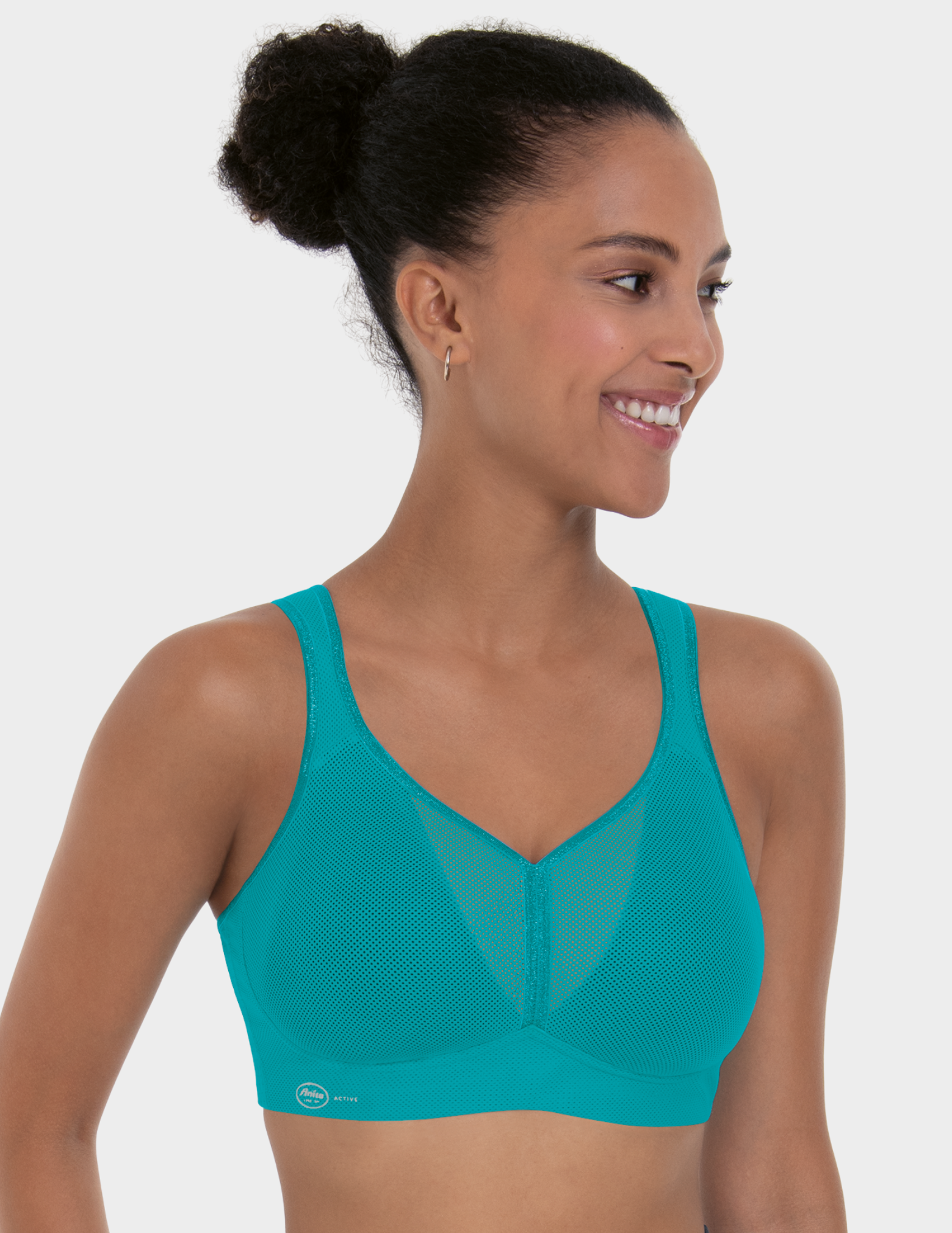 Front view of a model wearing Anita Air Control sports bra in color Peacock