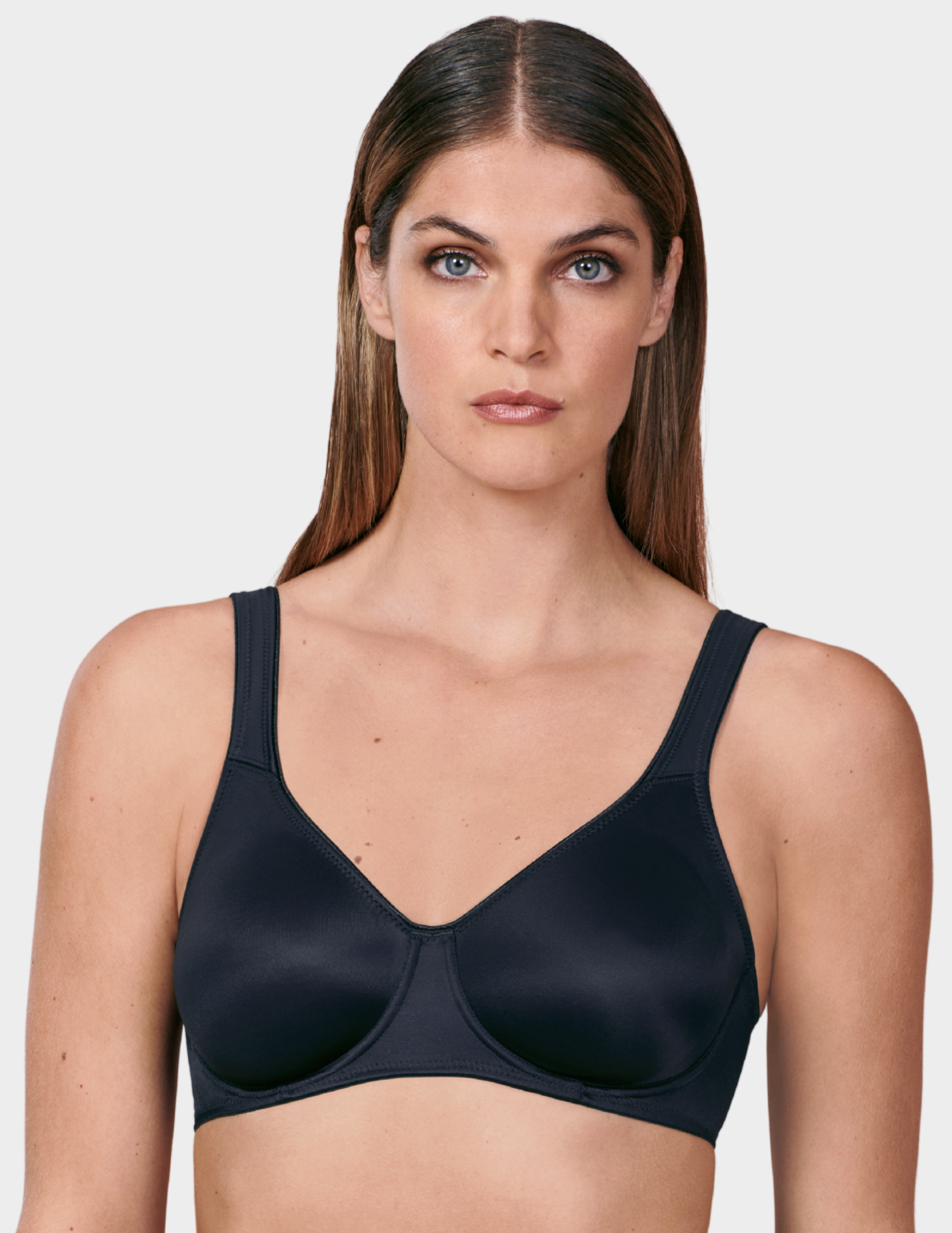 Front view of a model wearing a black Anita Twin bra