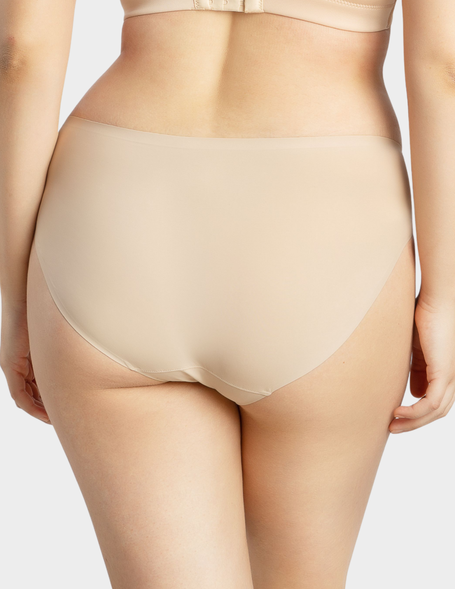 Back view of a model wearing Parfait Bonded hipster panty in european nude