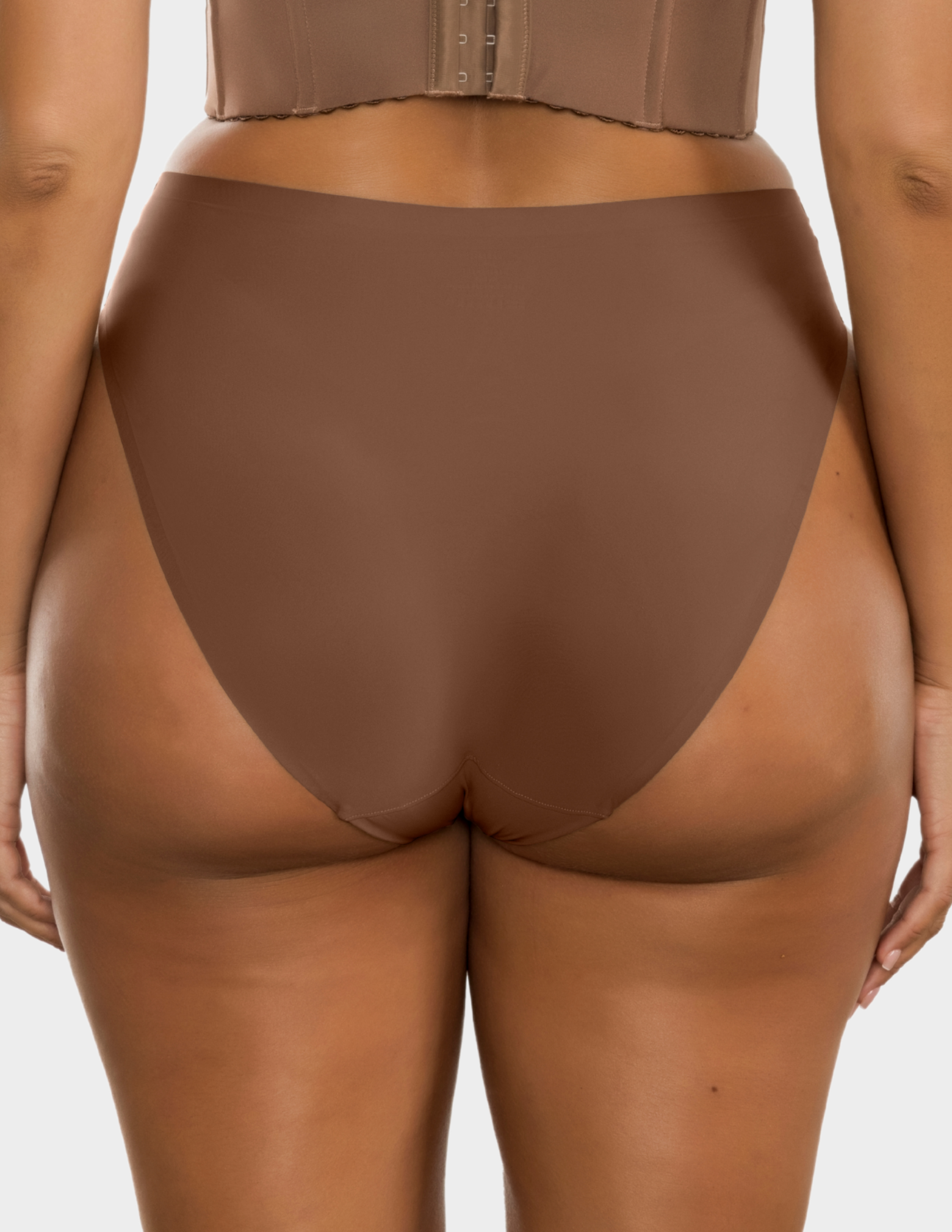 Back view of a model wearing Parfait Bonded French cut panty in Mid Nude