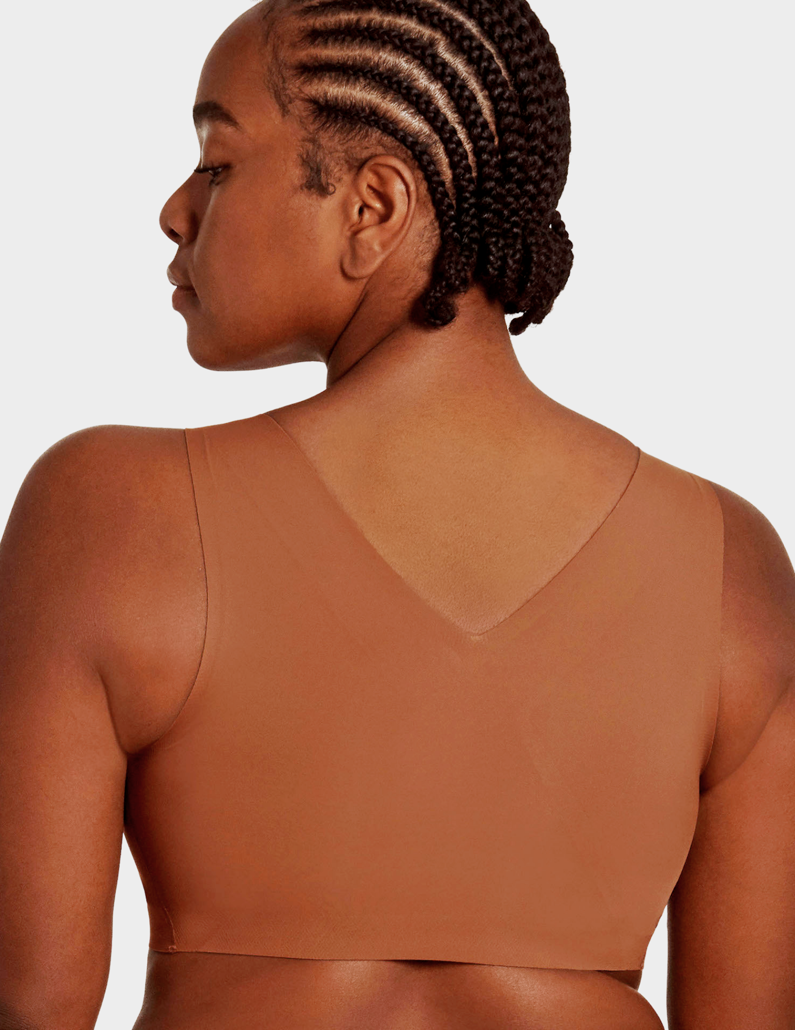 Back view of a model wearing Evelyn & Bobbie Defy bra in Clay