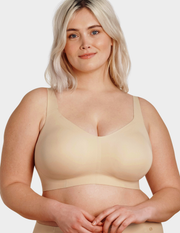 Front view of a model wearing Evelyn & Bobbie Beyond bra in Sand