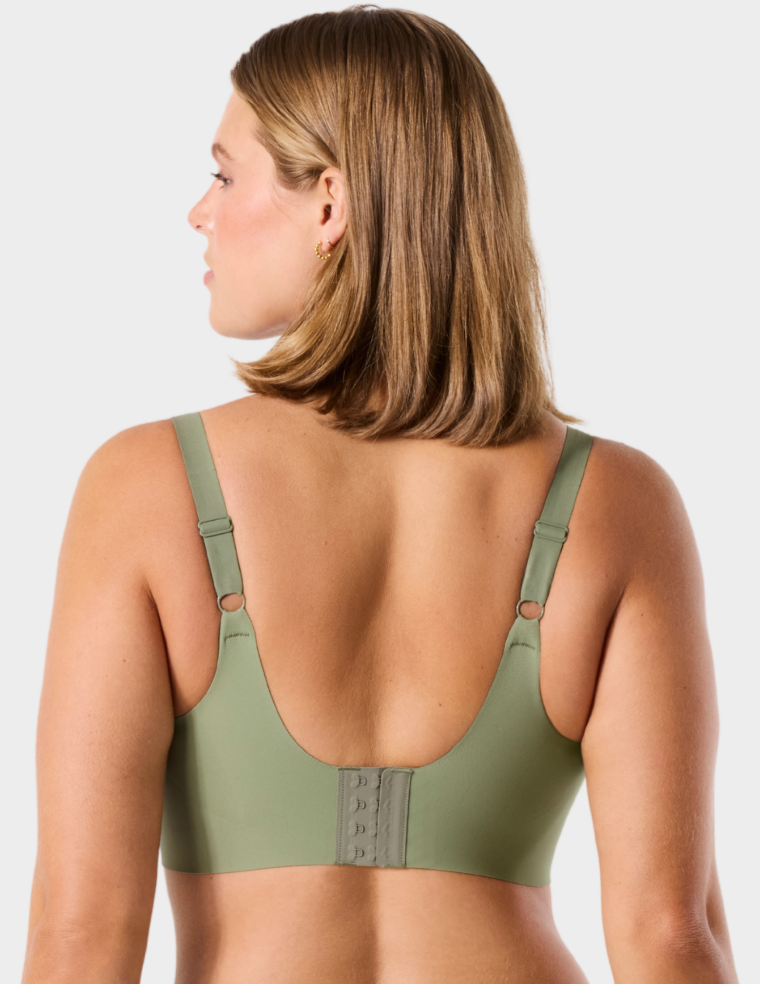 Back view of a model wearing Evelyn & Bobbie Beyond bra in Matcha