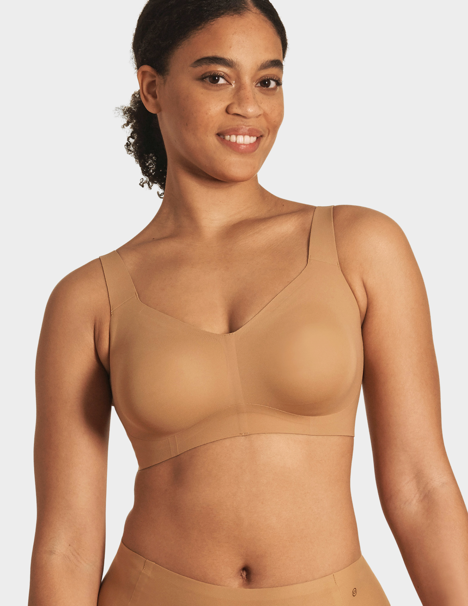 Front view of a model wearing Evelyn & Bobbie Beyond bra in Mica