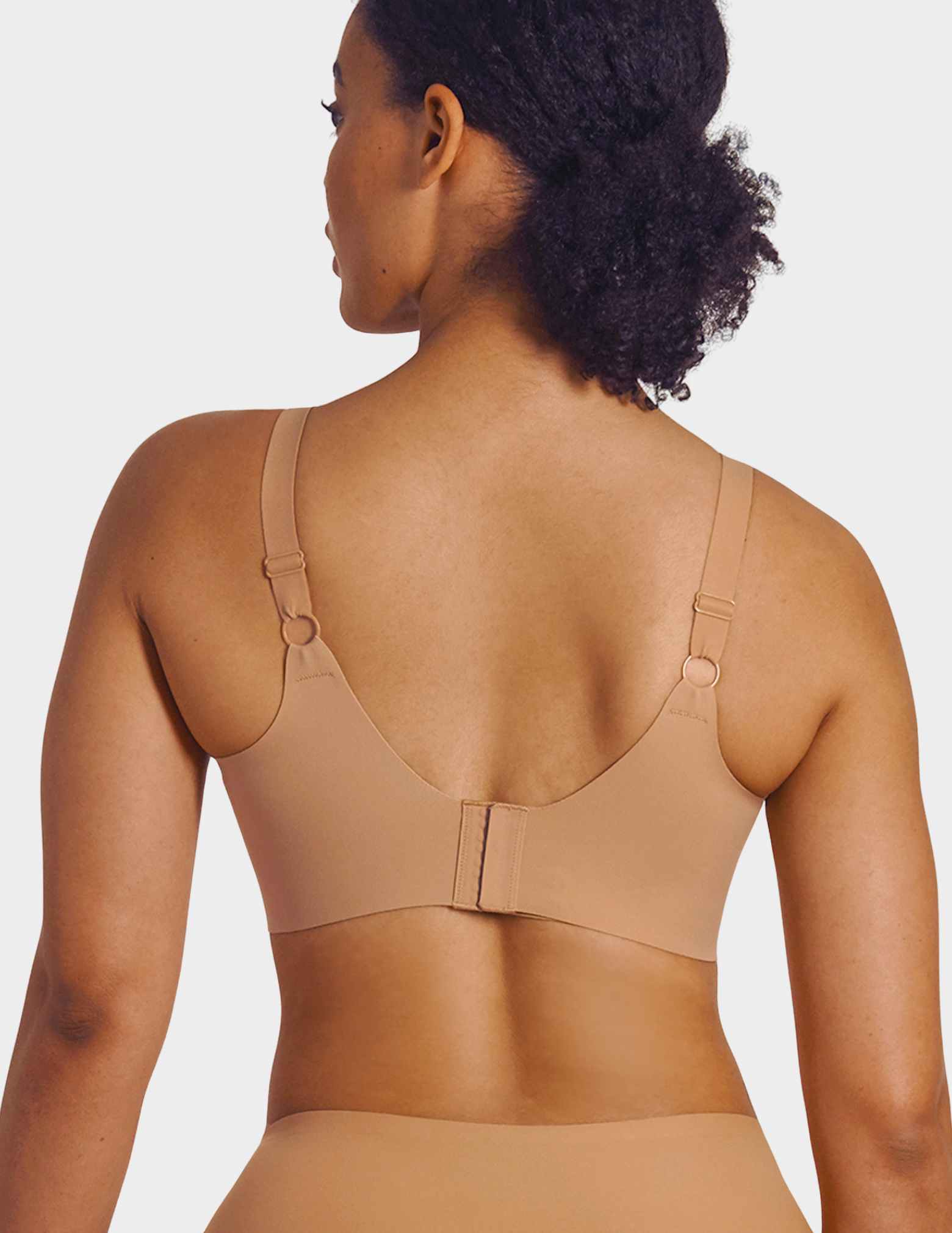 Back view of a model wearing Evelyn & Bobbie Beyond bra in Mica