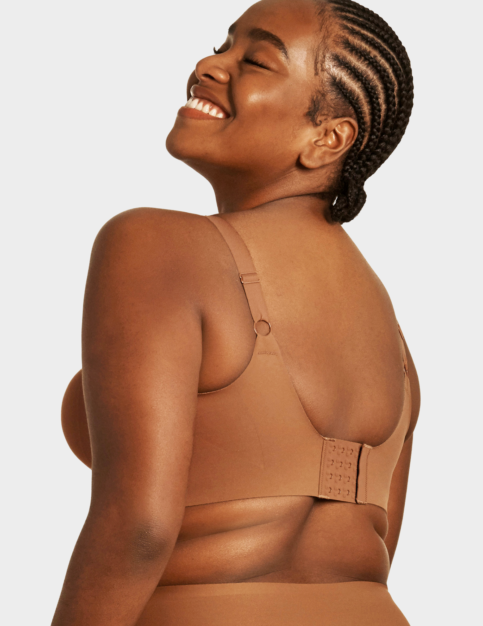 Back view of a model wearing Evelyn & Bobbie Beyond bra in Clay