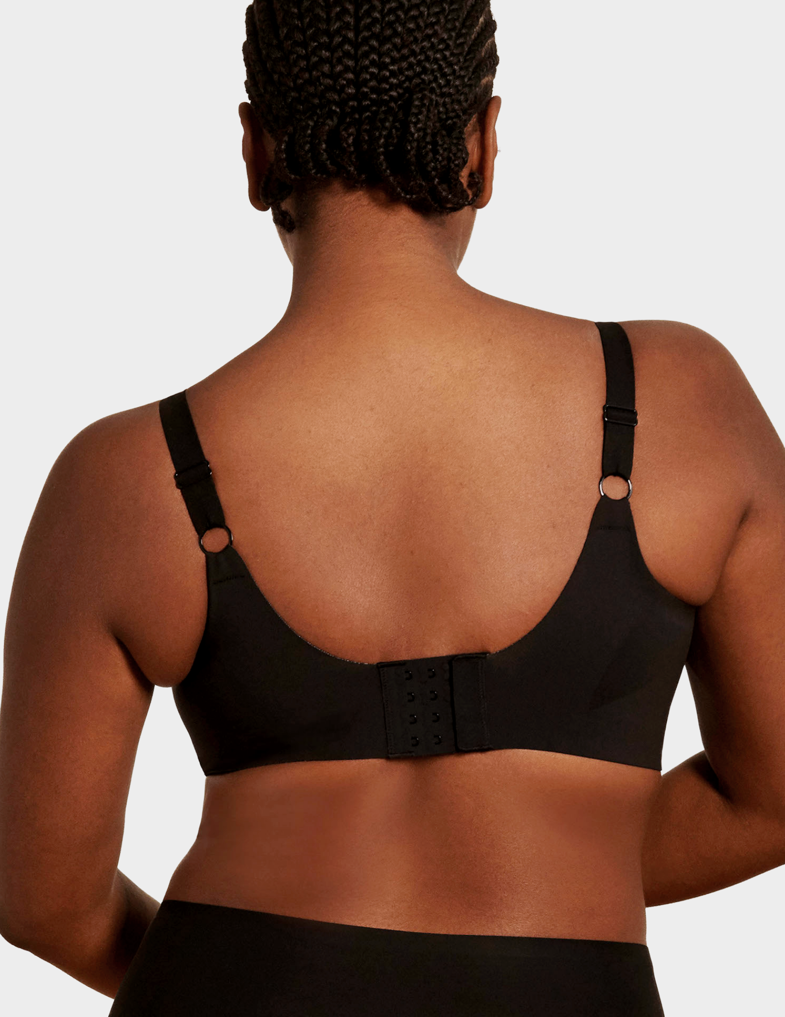 Back view of a model wearing Evelyn & Bobbie Beyond bra in Black