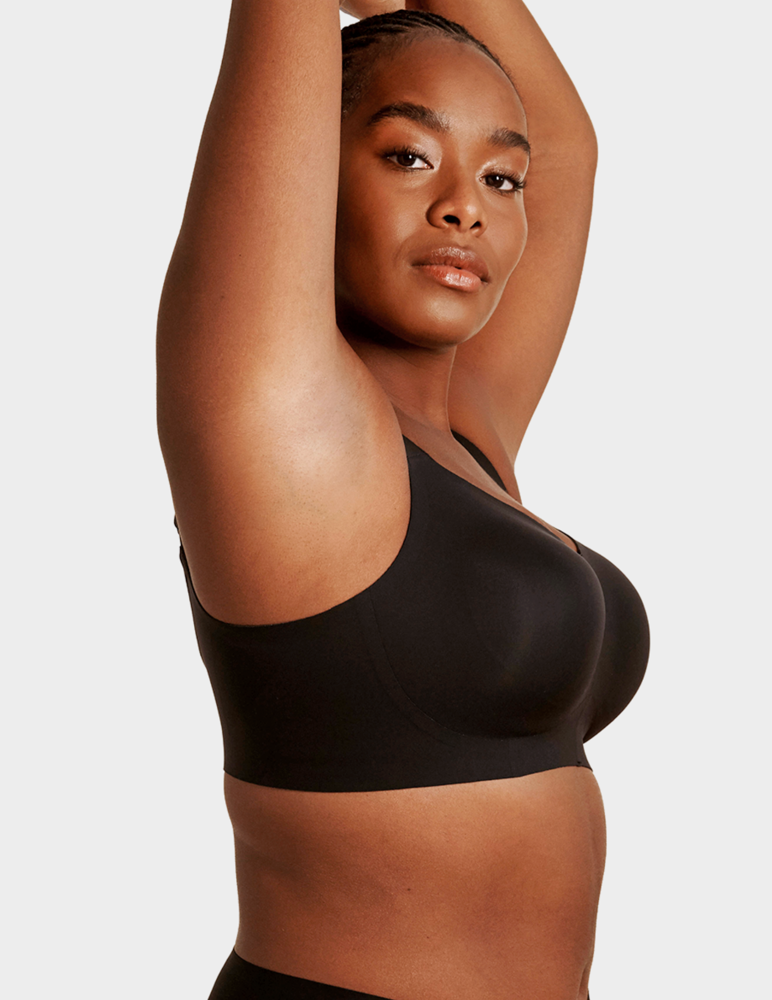 Side view of a model wearing Evelyn & Bobbie Beyond bra in Black