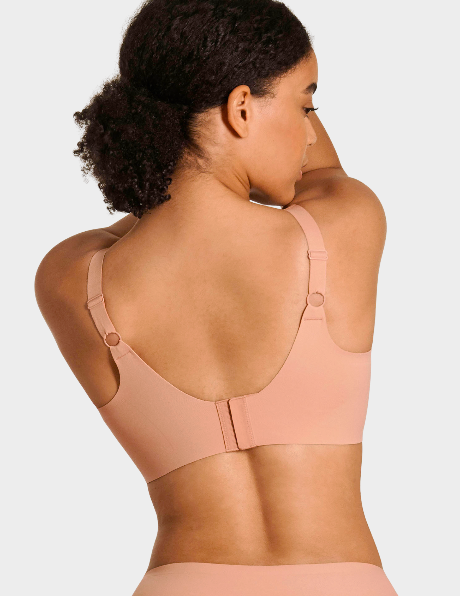 Back view of a model wearing Evelyn & Bobbie Beyond bra in Himalayan Salt