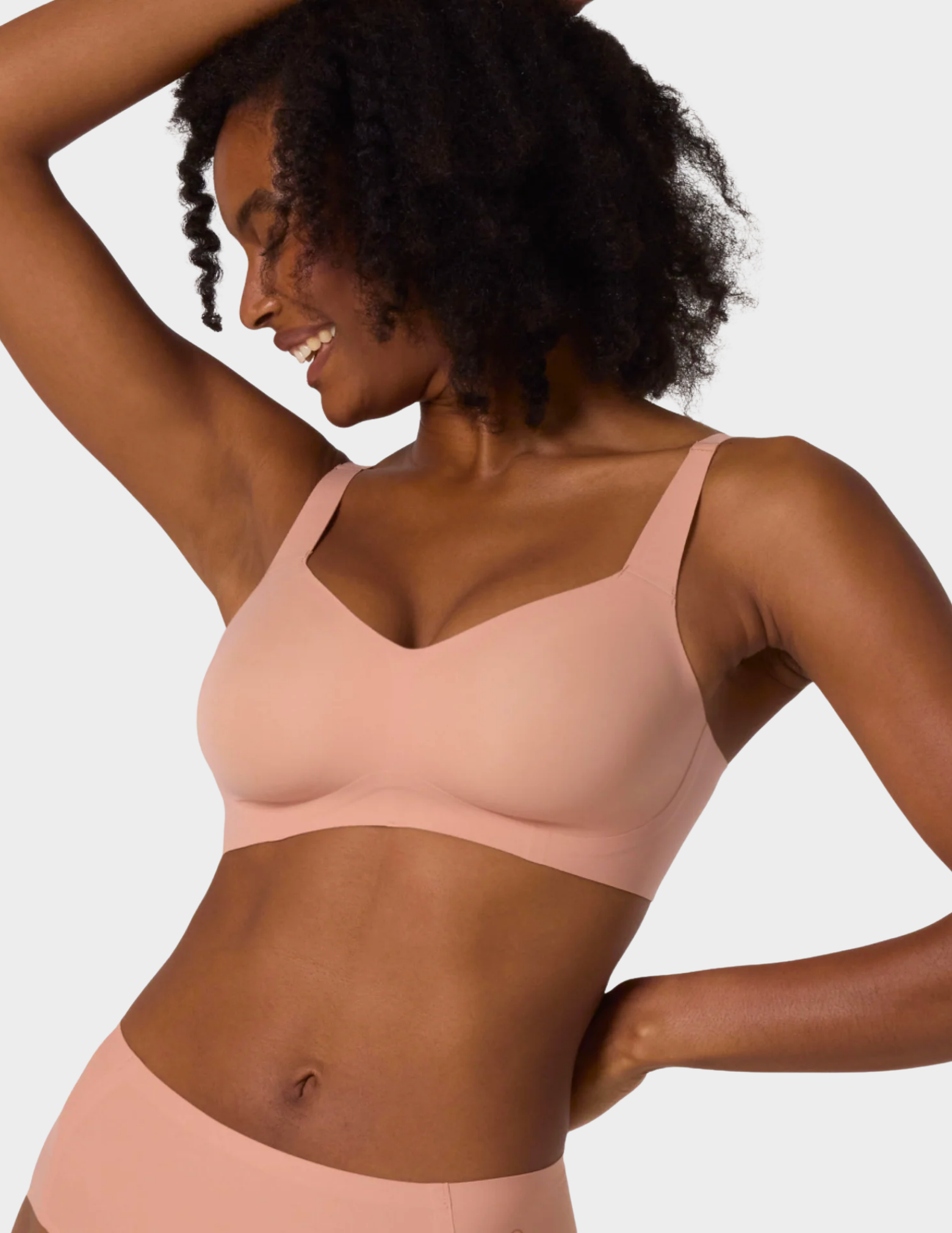 Front view of a model wearing Evelyn & Bobbie Beyond bra in Himalayan Salt