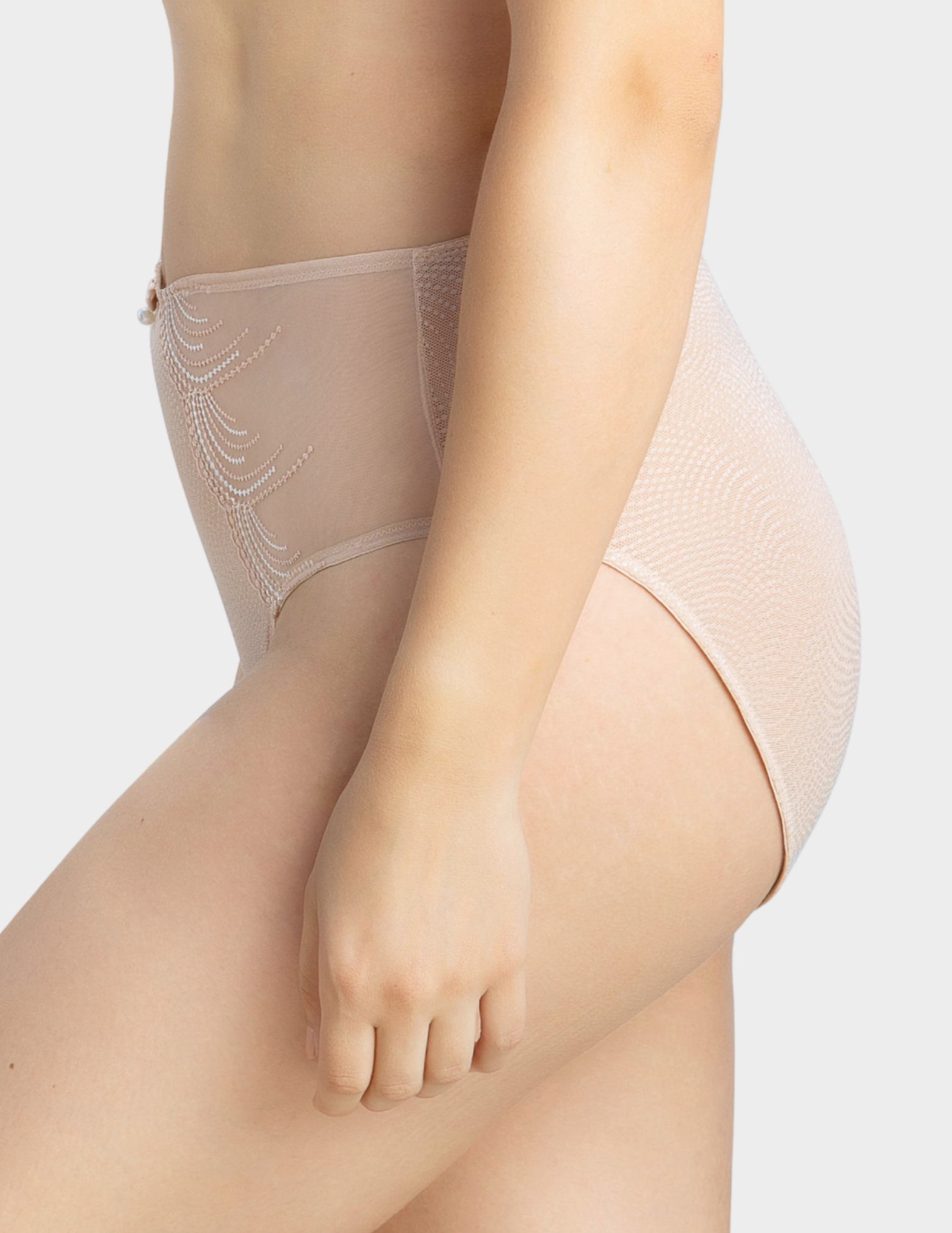 Side view of a model wearing Parfait Pearl panty in cameo rose