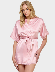 Front view of a model wearing a light pink satin robe