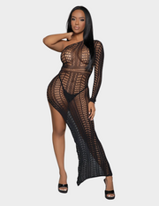 Front view of a model wearing a long black bodystocking dress