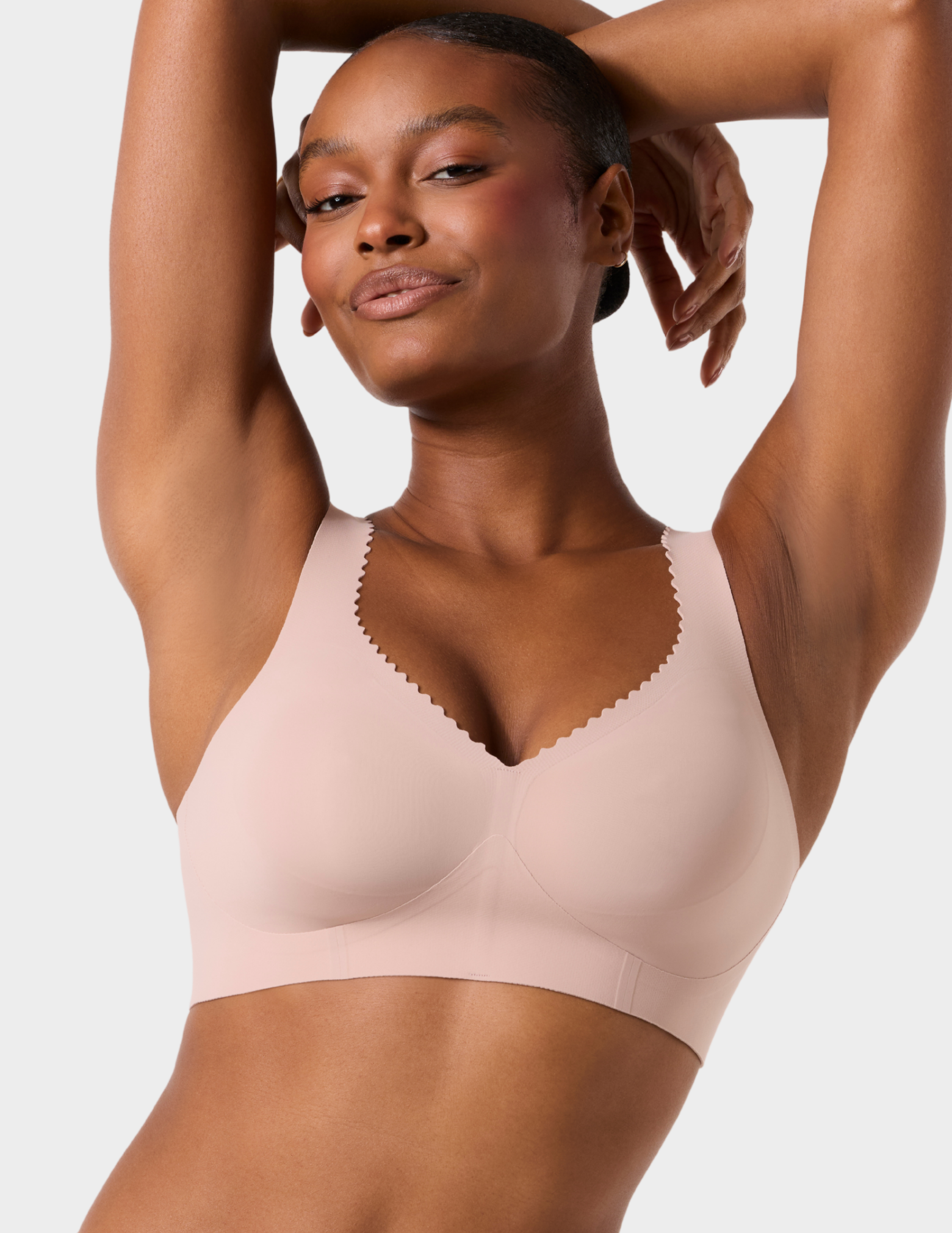 Front view of a model wearing Evelyn & Bobbie Evelyn Bra in color Petal Drift