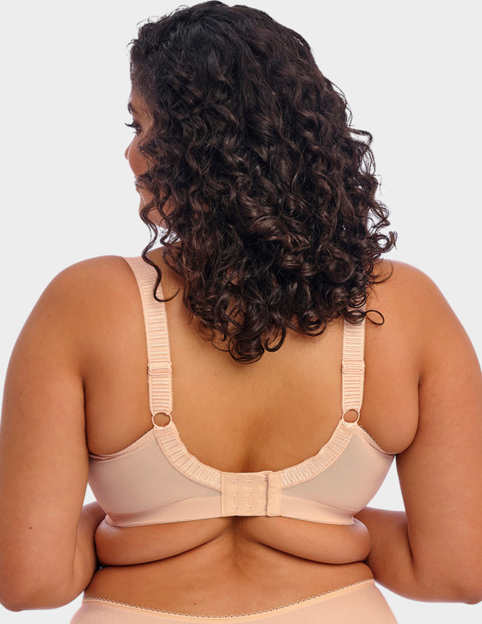 Back view of a model wearing Elomi Cate soft cup bra in latte
