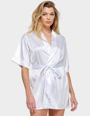 Front view of a model wearing a white satin robe