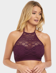 Front view of a model wearing Freya Sundance hi-neck bikini top in black cherry