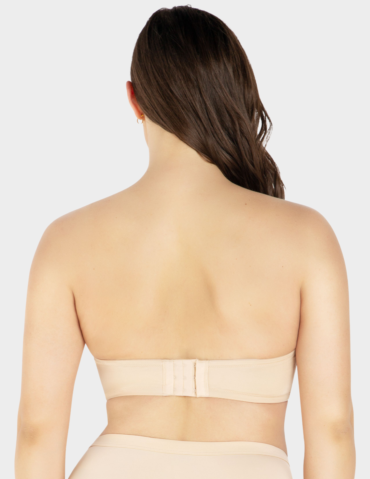 Back view of a model wearing Parfait Elise strapless bra in Bare