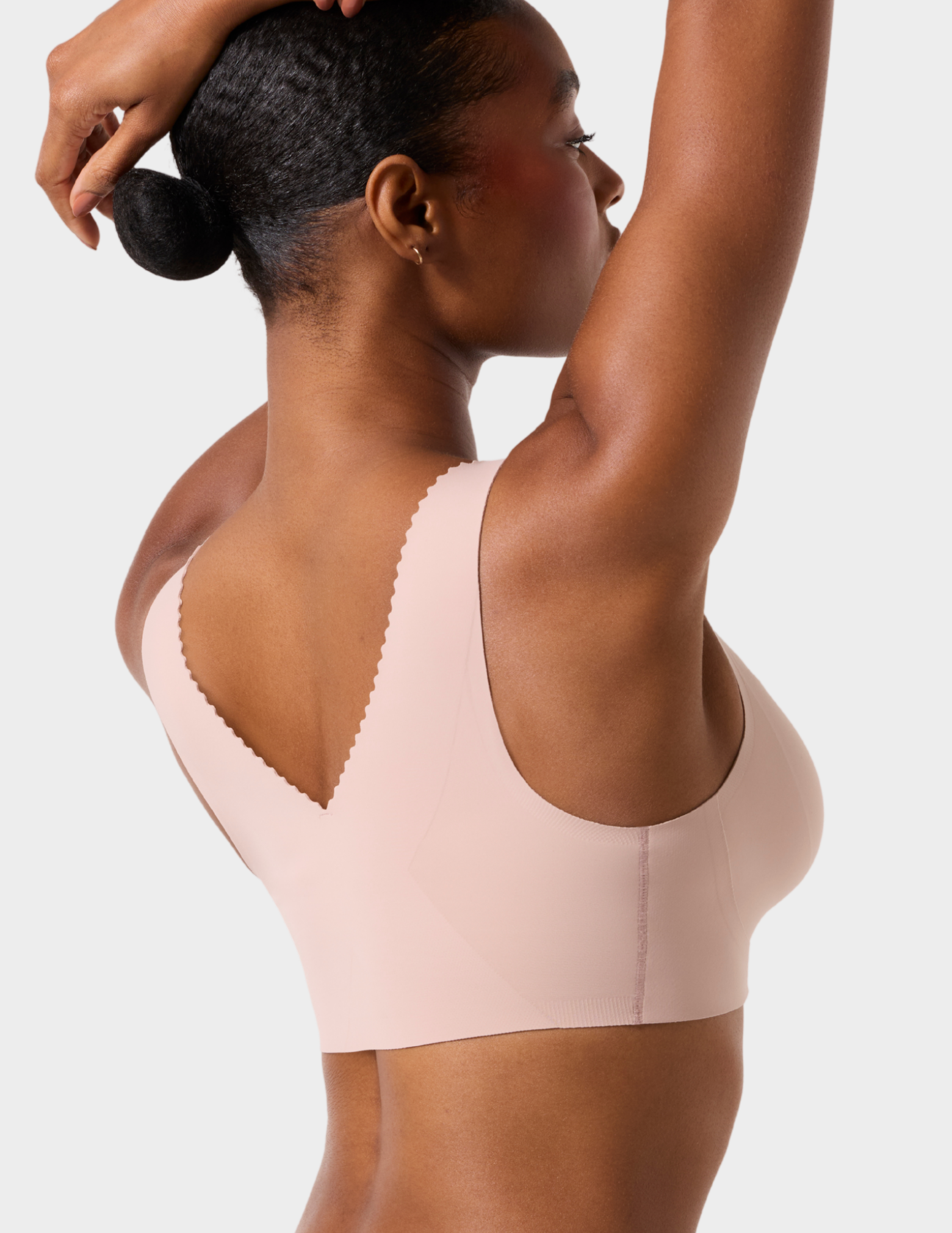 Back view of a model wearing Evelyn & Bobbie Evelyn Bra in color Petal Drift