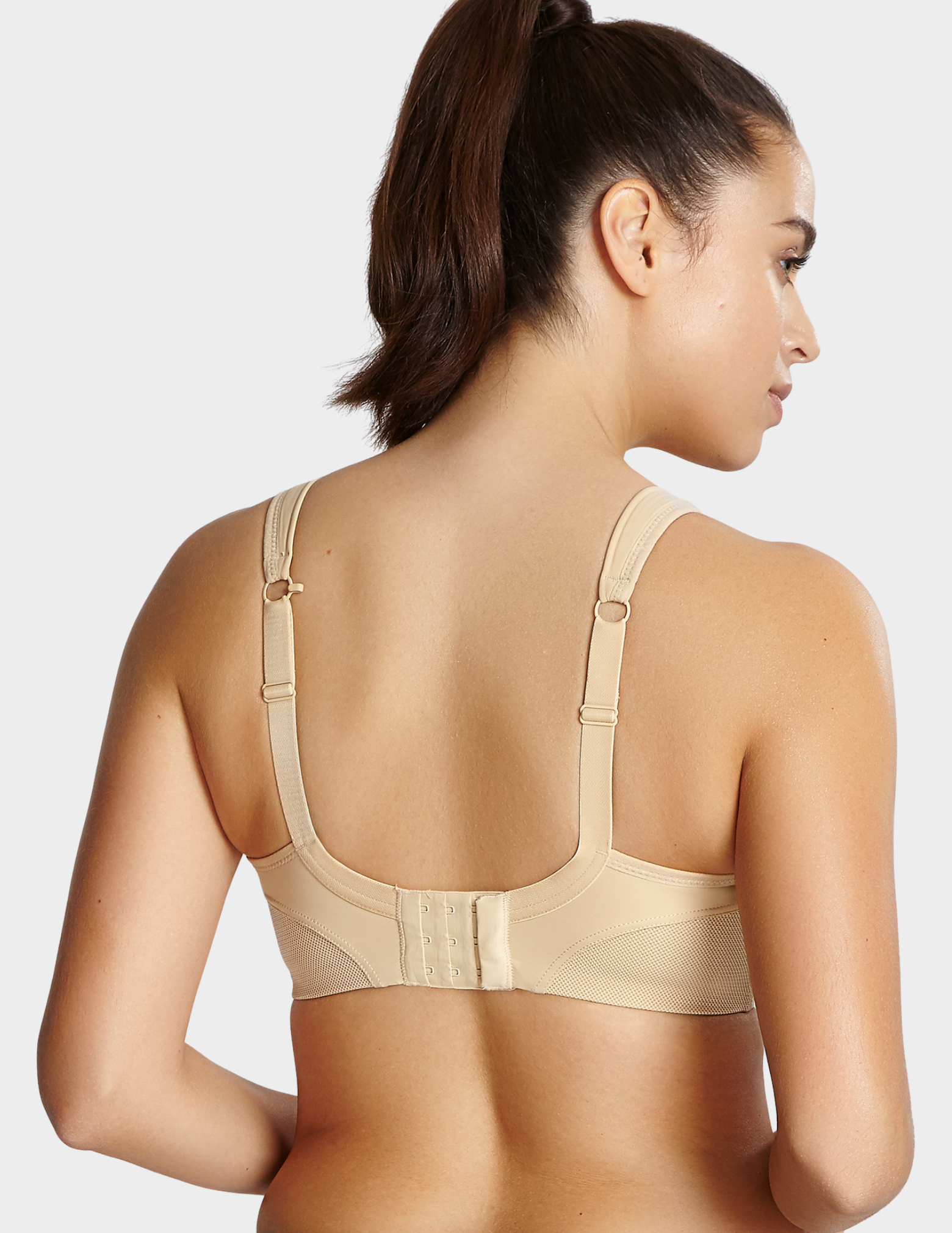 Back view of a model wearing Panache Non wired sports bra in Latte
