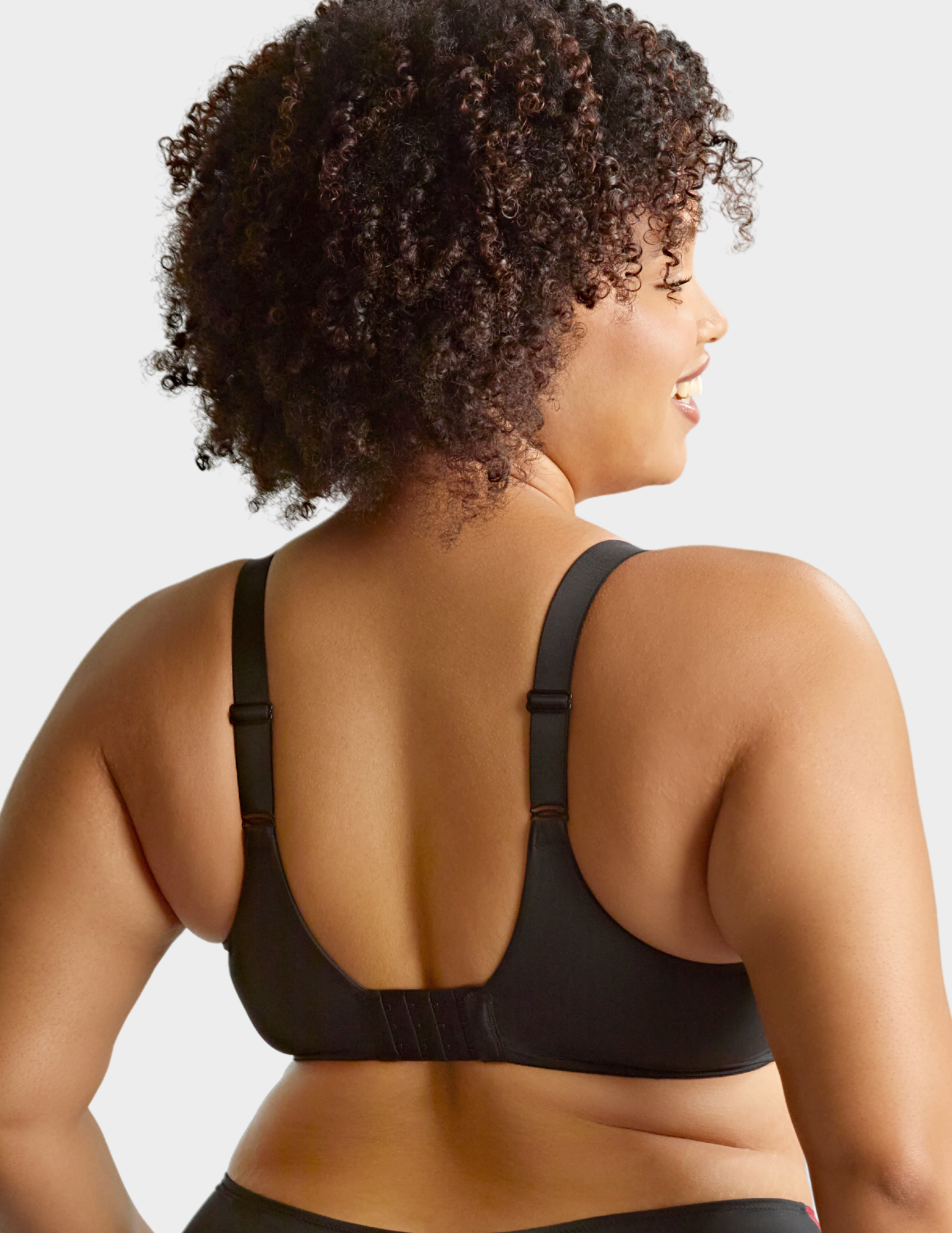 Back view of a model wearing Sculptresse Bliss bra in Rose Print