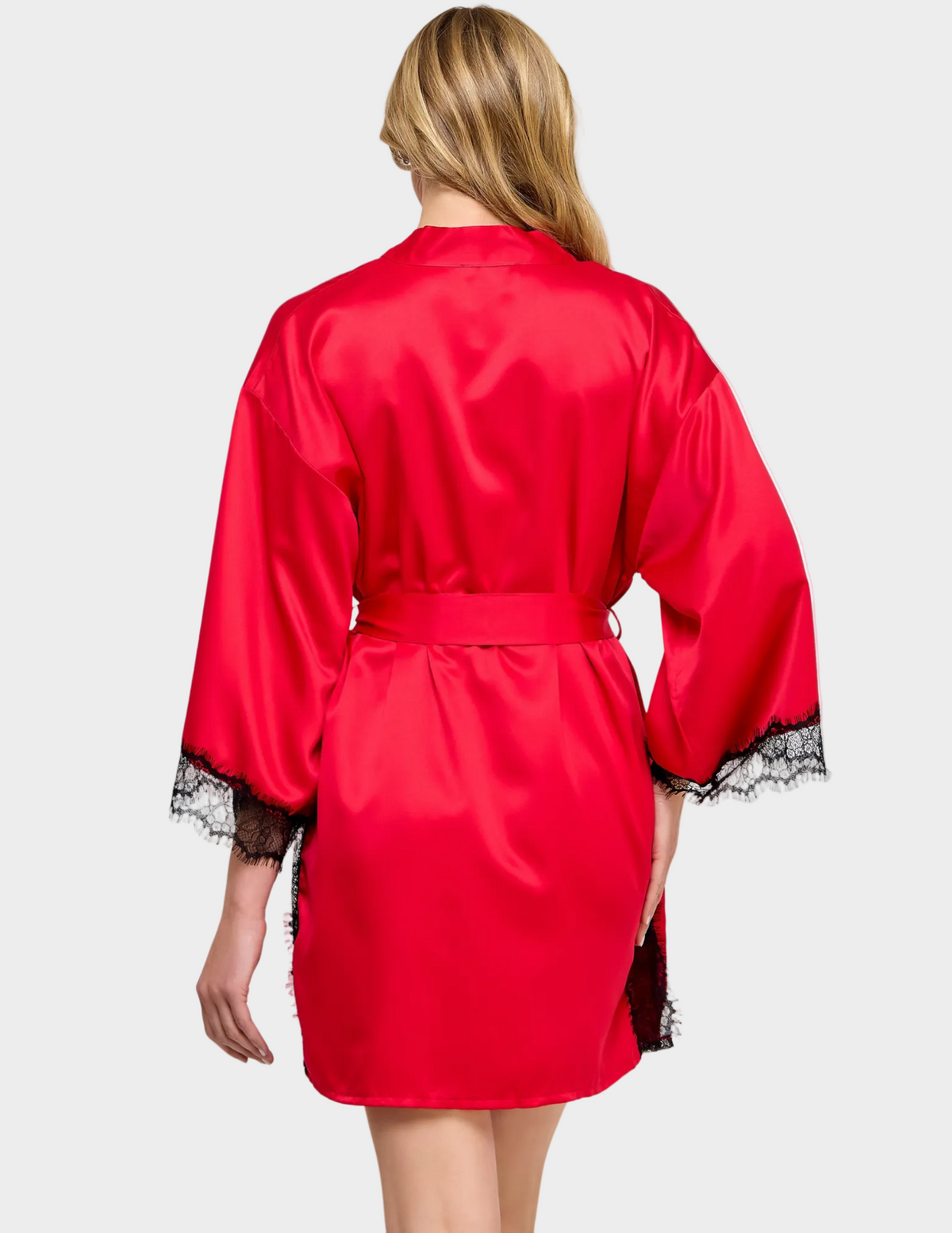 Back view of a model wearing a red satin robe with black lace trim