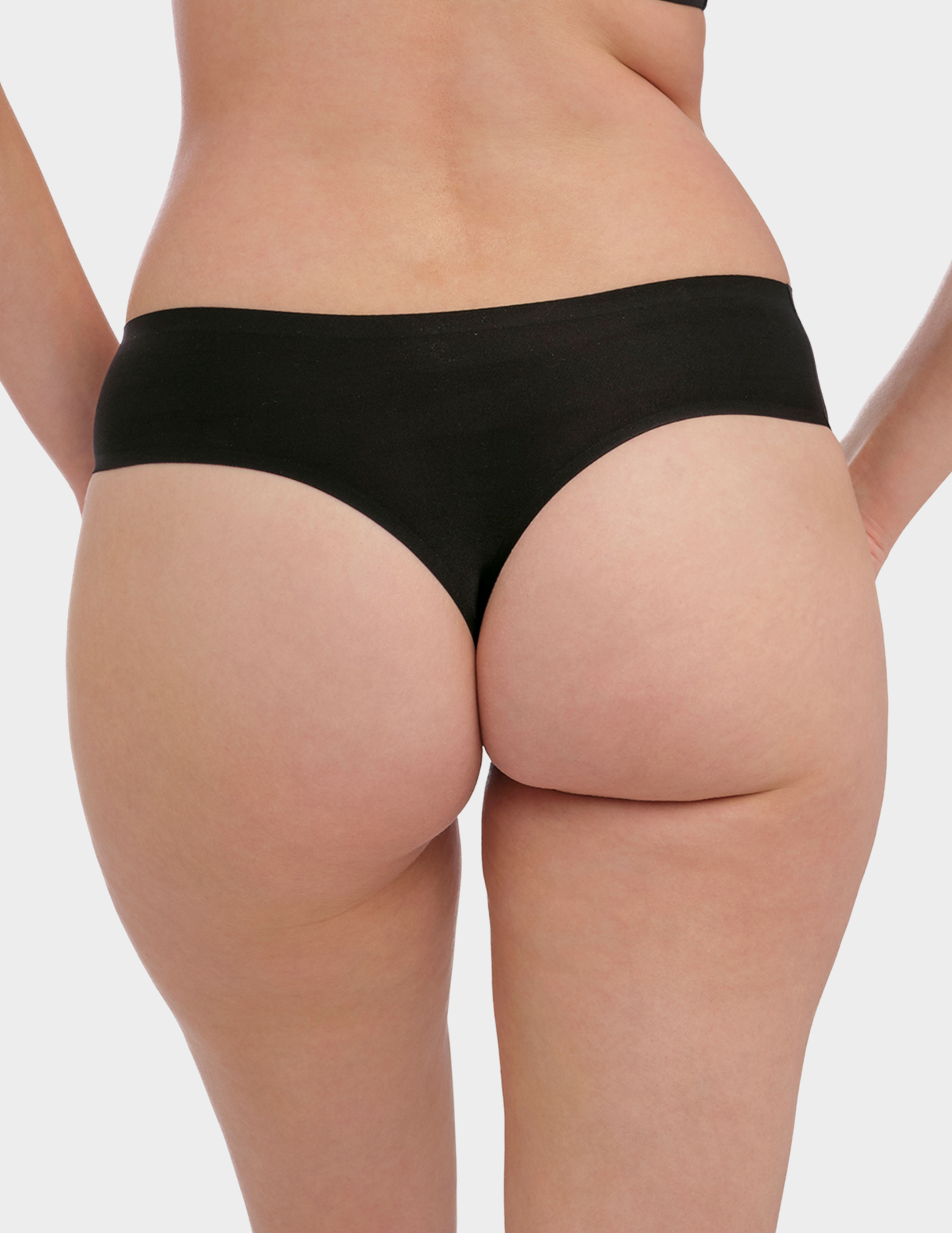 Back view of a model wearing Fantasie Smoothease thong in Black