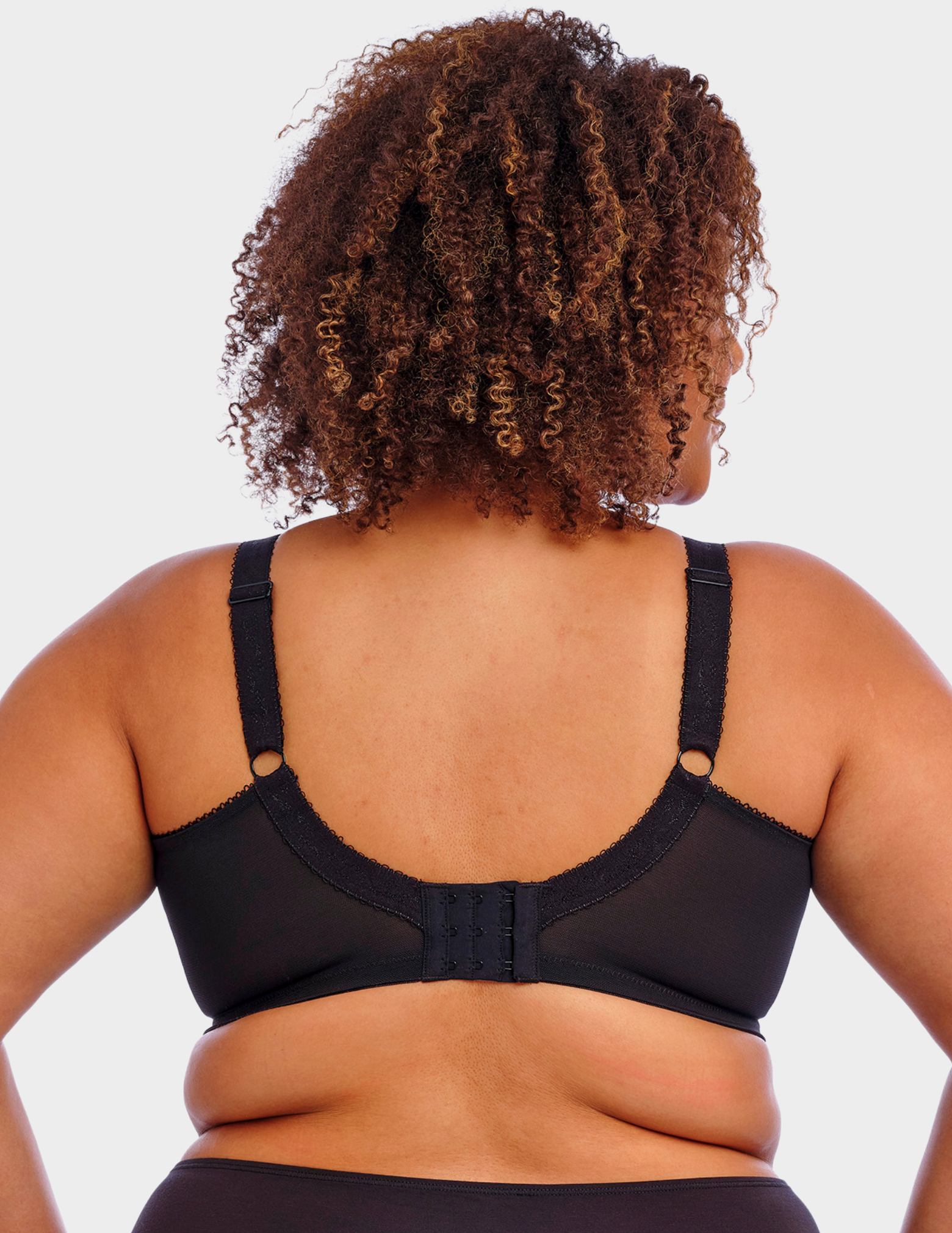 Back view of a model wearing Goddess Keira bra in black