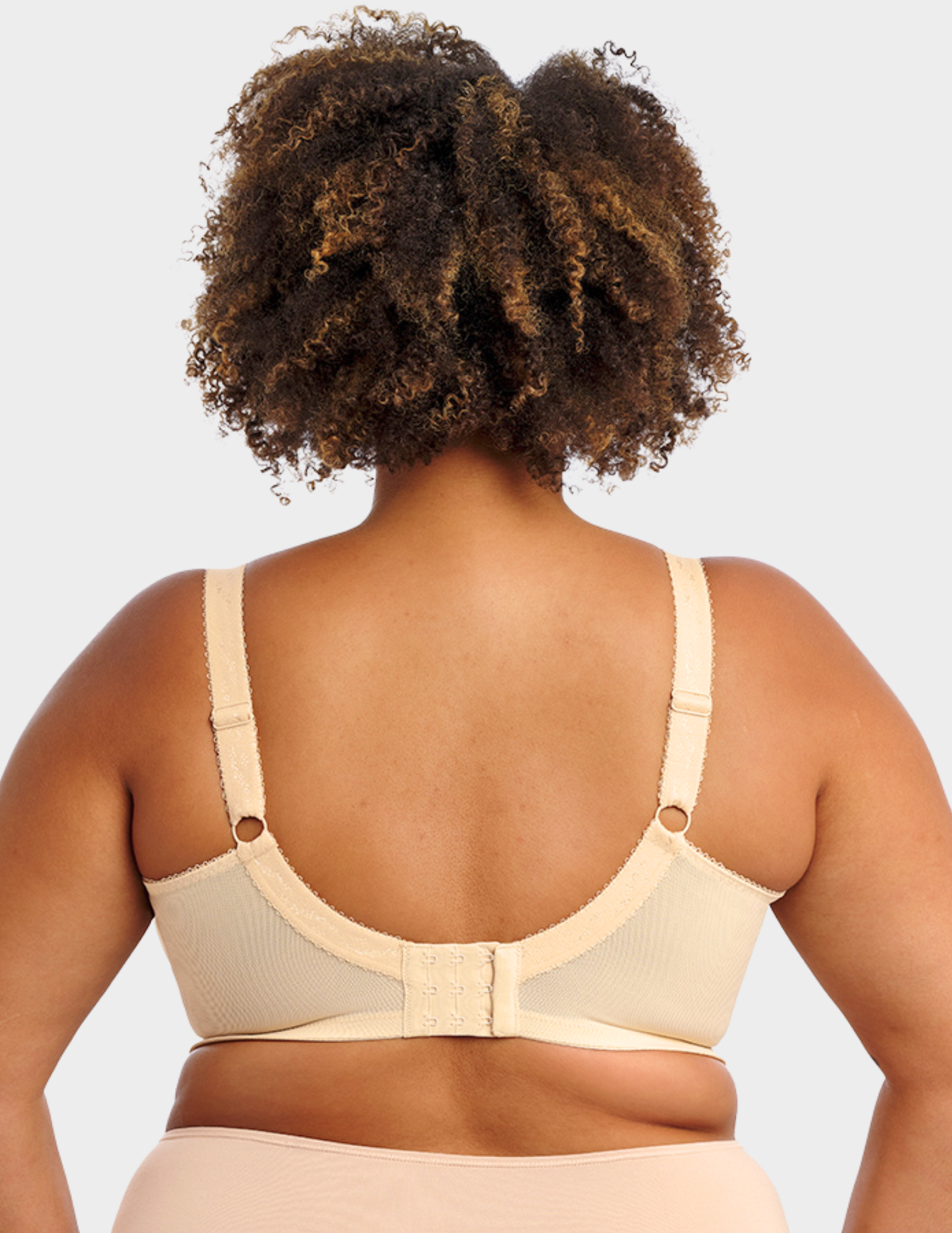 Back view of a model wearing Goddess Keira bra in nude