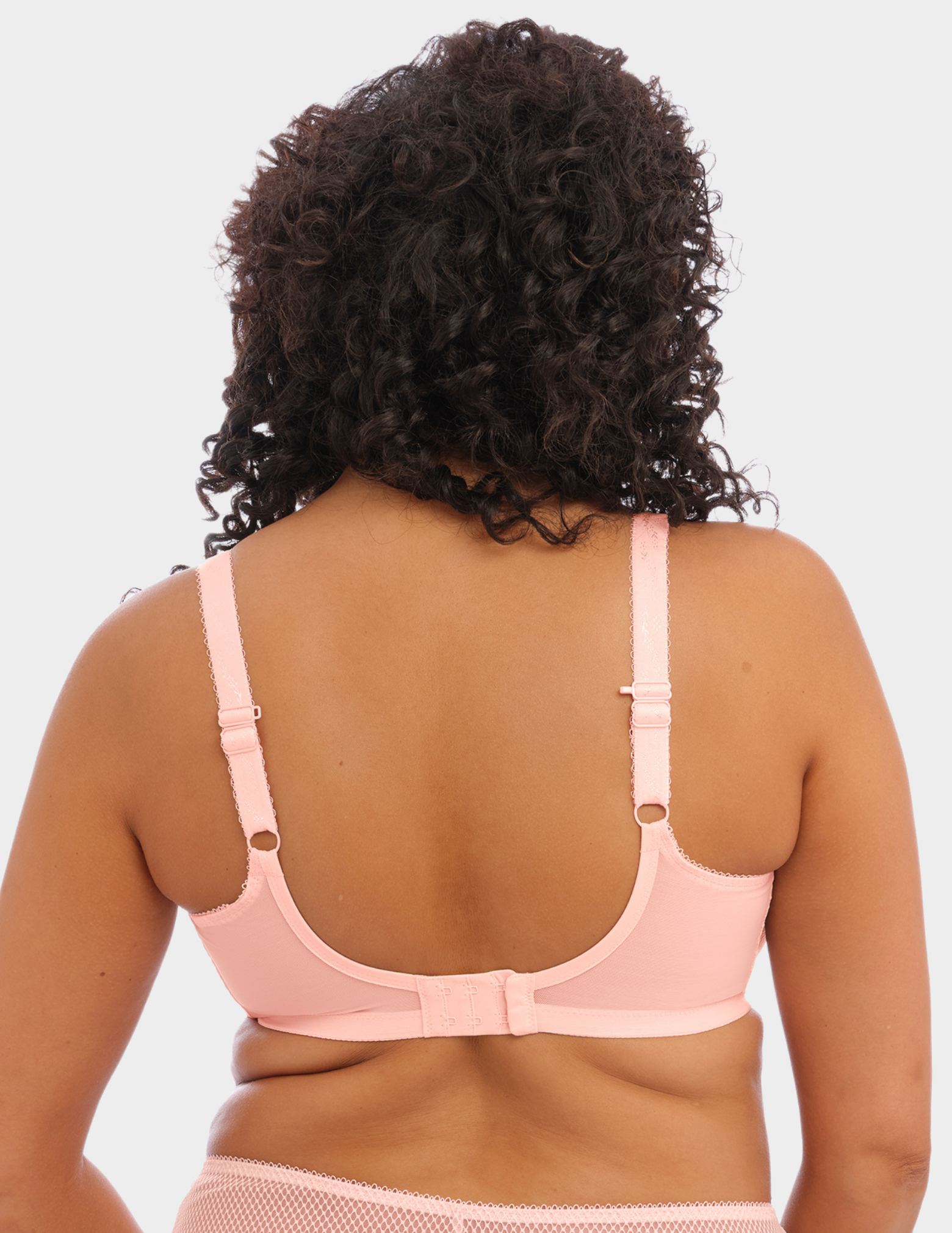 Back view of a model wearing Elomi Charley stretch plunge bra in ballet pink