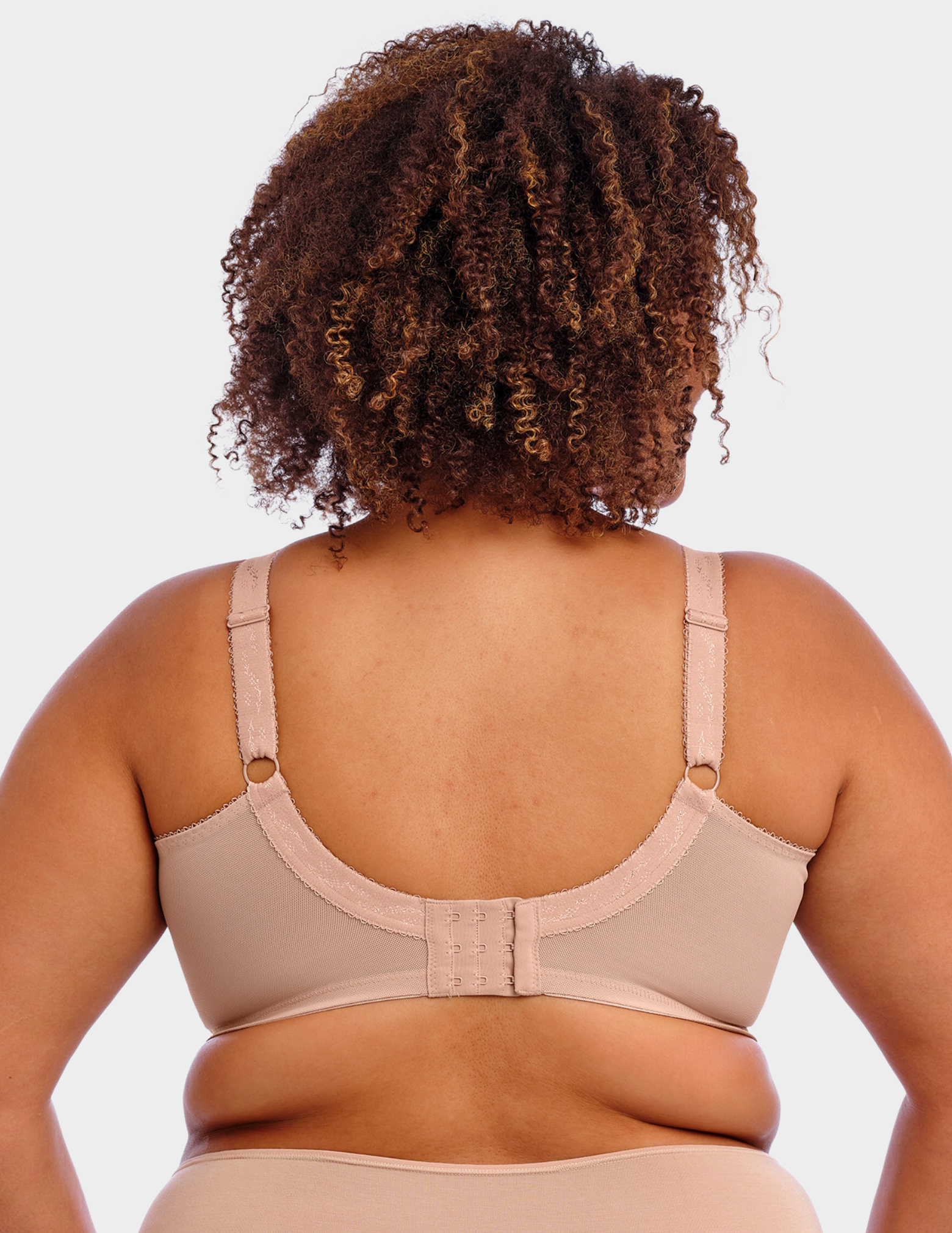 Back view of a model wearing Goddess Keira bra in fawn