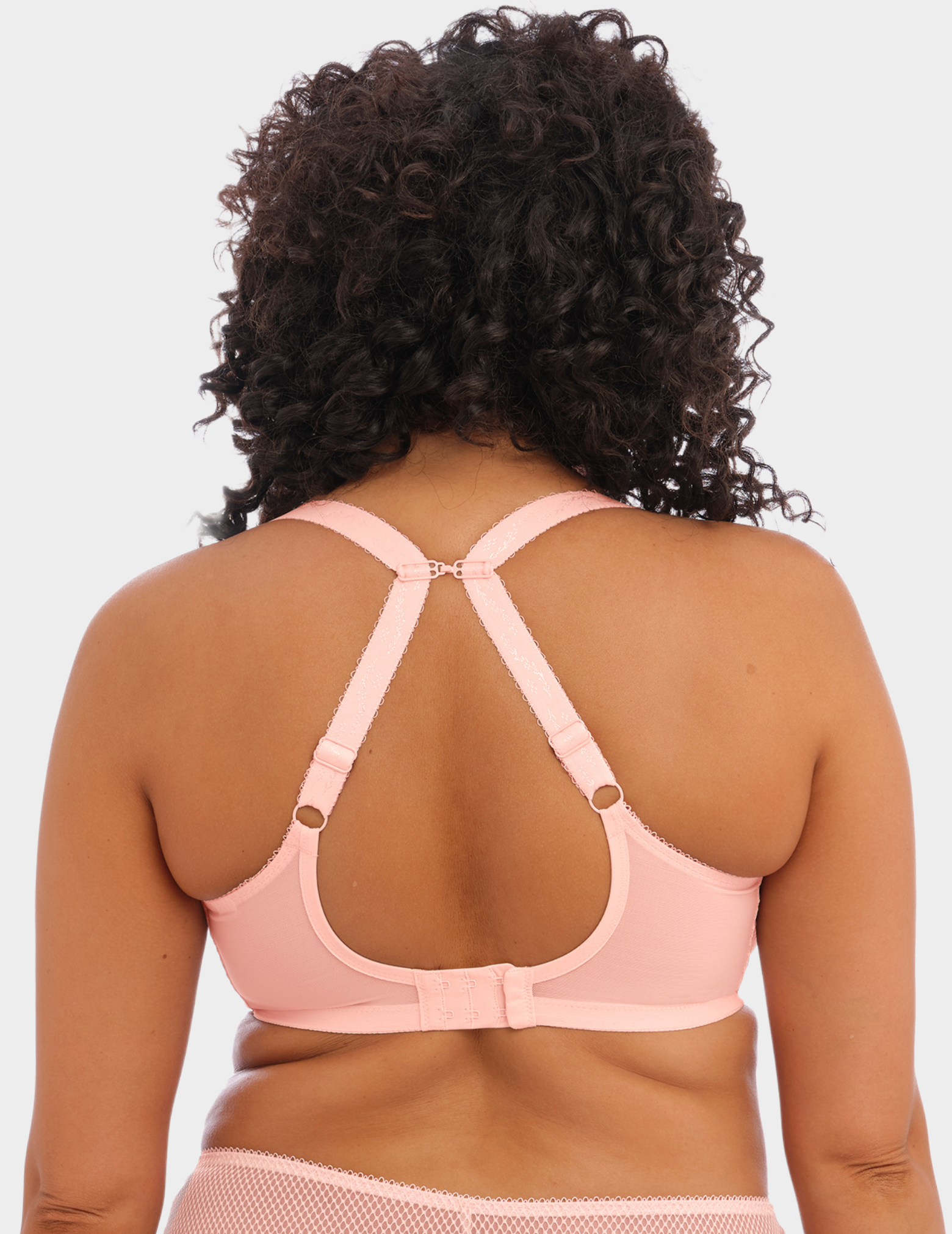 Front view of a model wearing Elomi Charley stretch plunge bra in ballet pink with straps hooked