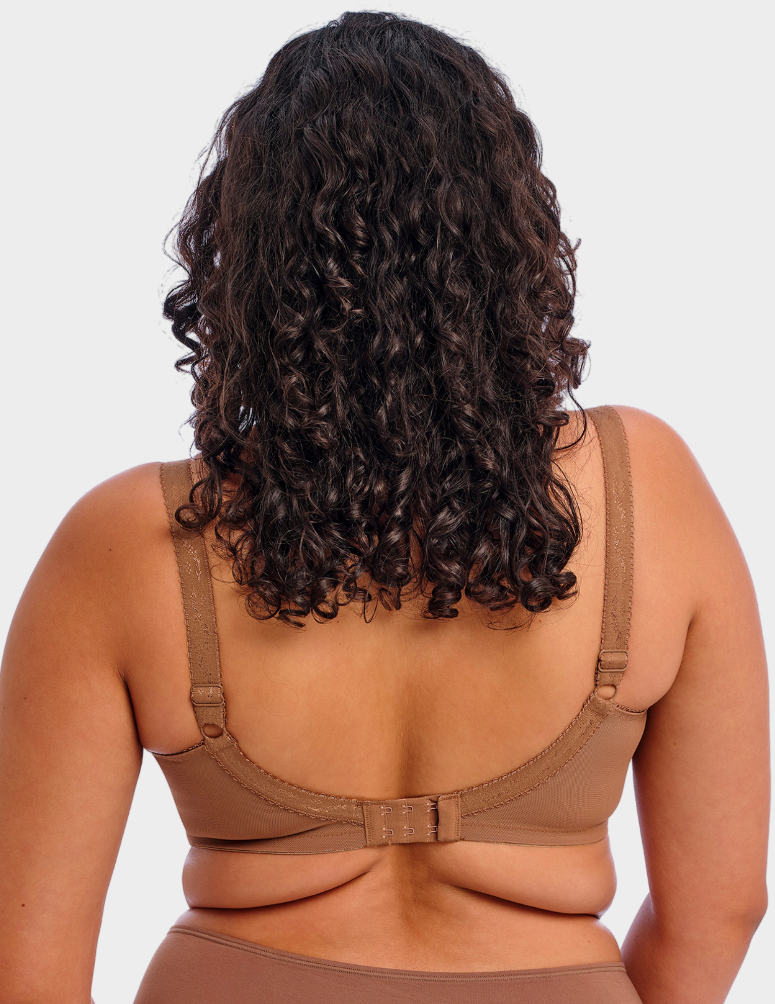 Back view of a model wearing Goddess Keira bra in cinnamon