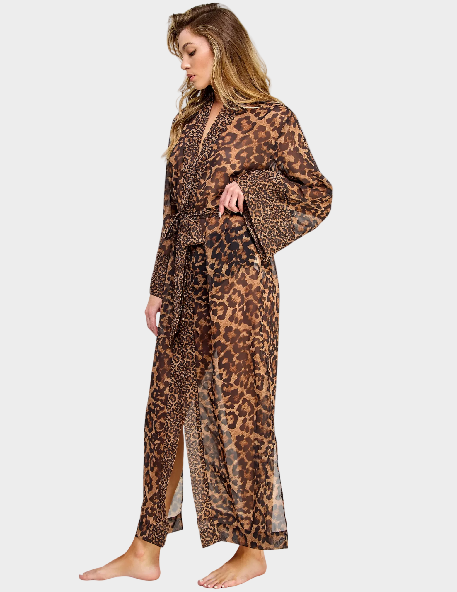 Side view of a model wearing a sheer leopard print robe