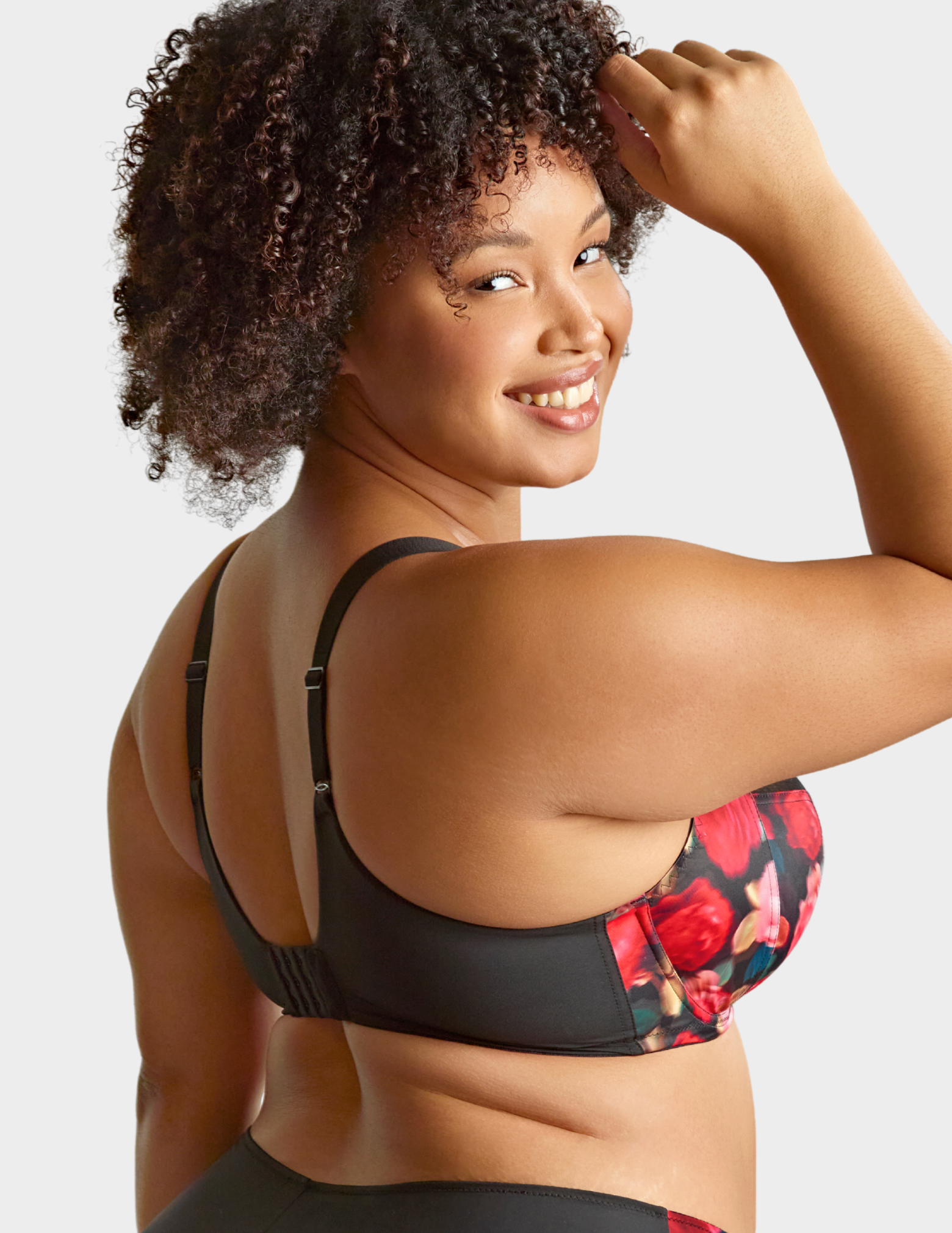 Side view of a model wearing Sculptresse Bliss bra in Rose Print