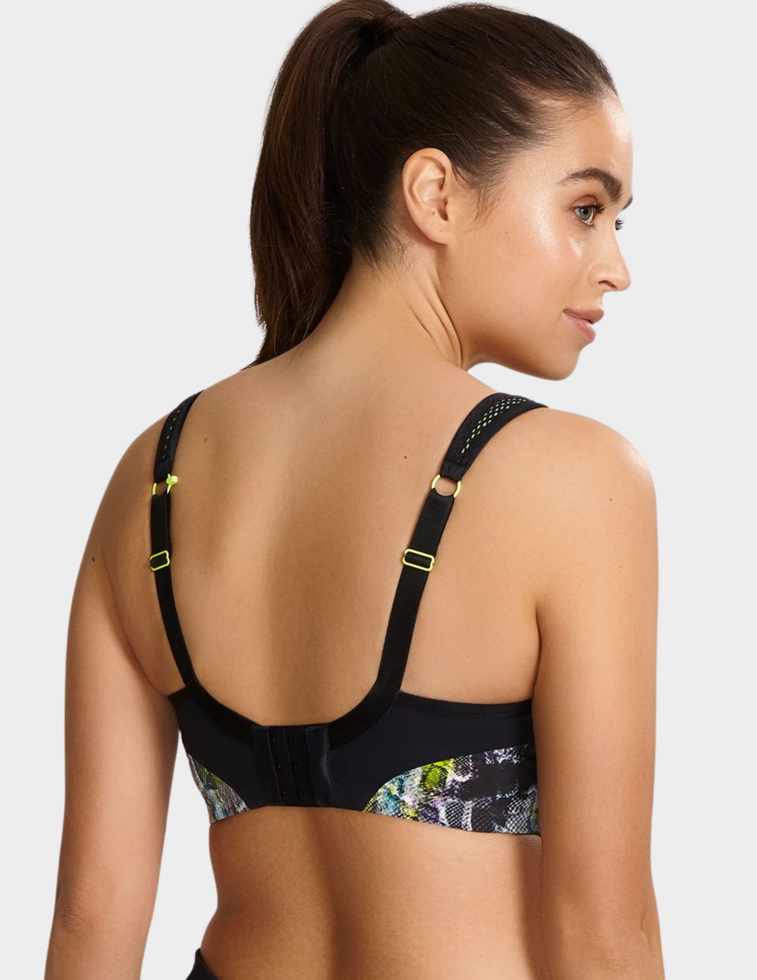 Back view of a model wearing Panache Non wired sports bra in Neon Reptile