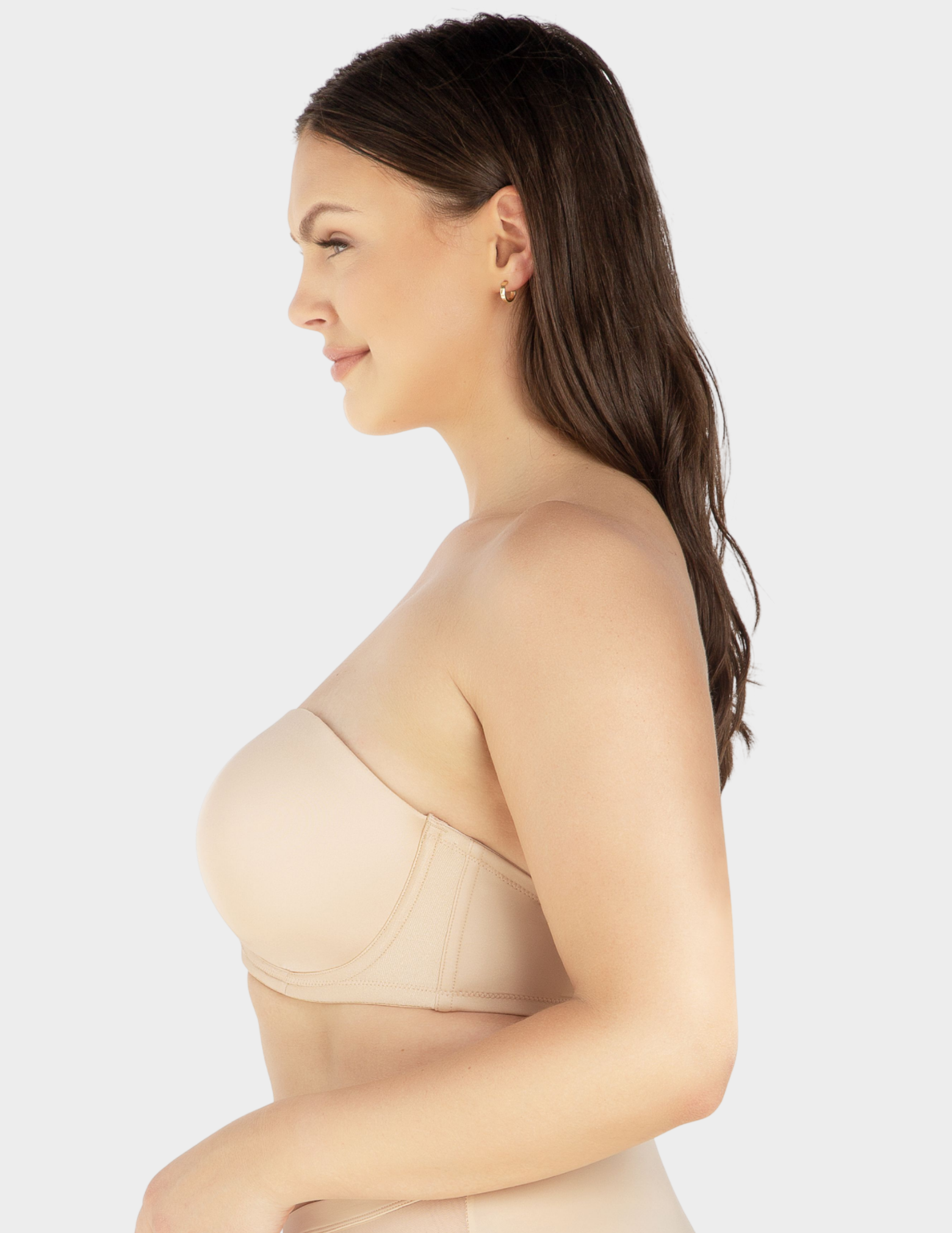 Side view of a model wearing Parfait Elise strapless bra in Bare