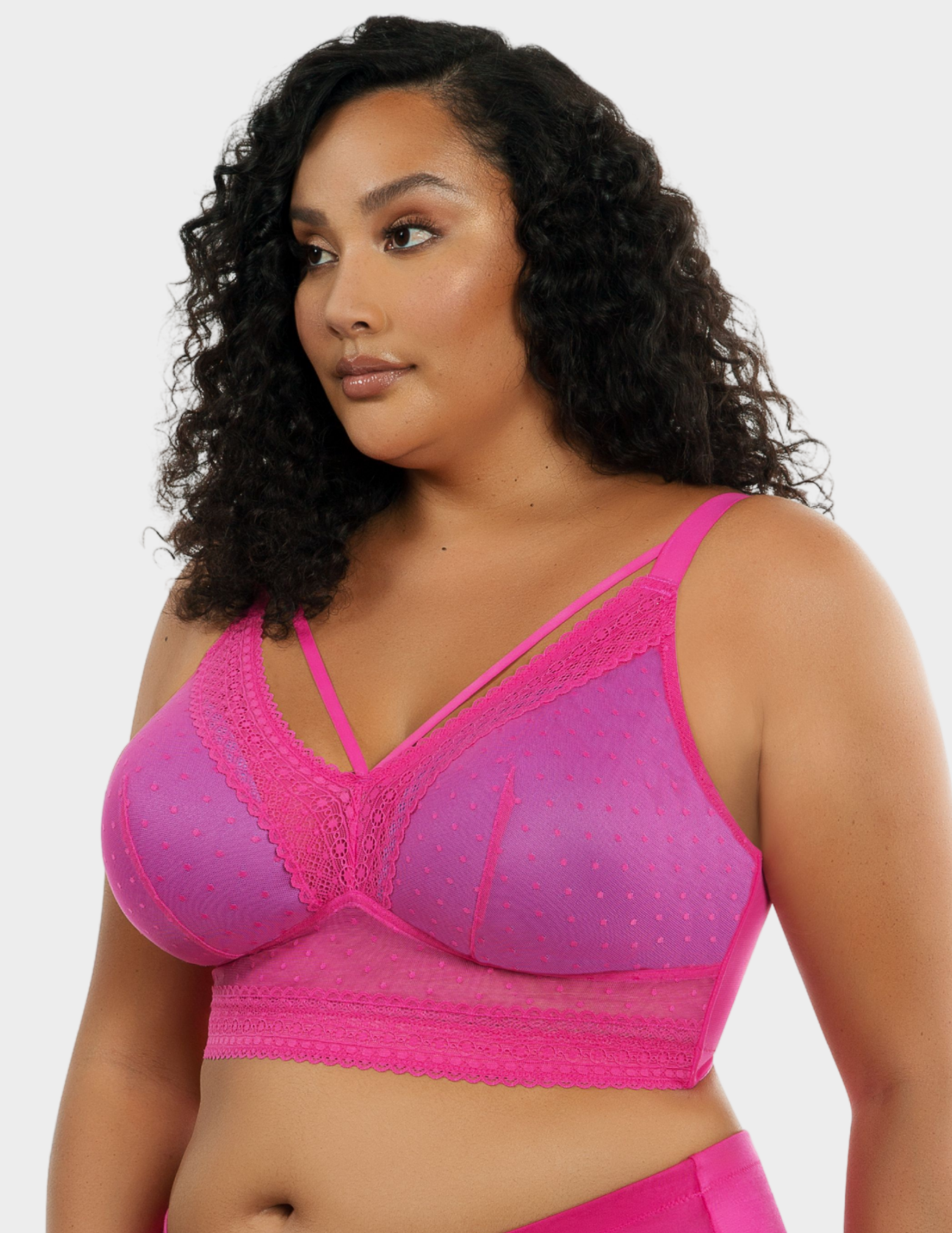 Side view of a model wearing Parfait Mia bralette in Bright Pink