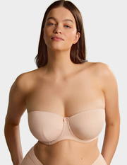 Front view of a model wearing Sculptresse Dana strapless bra in Linen