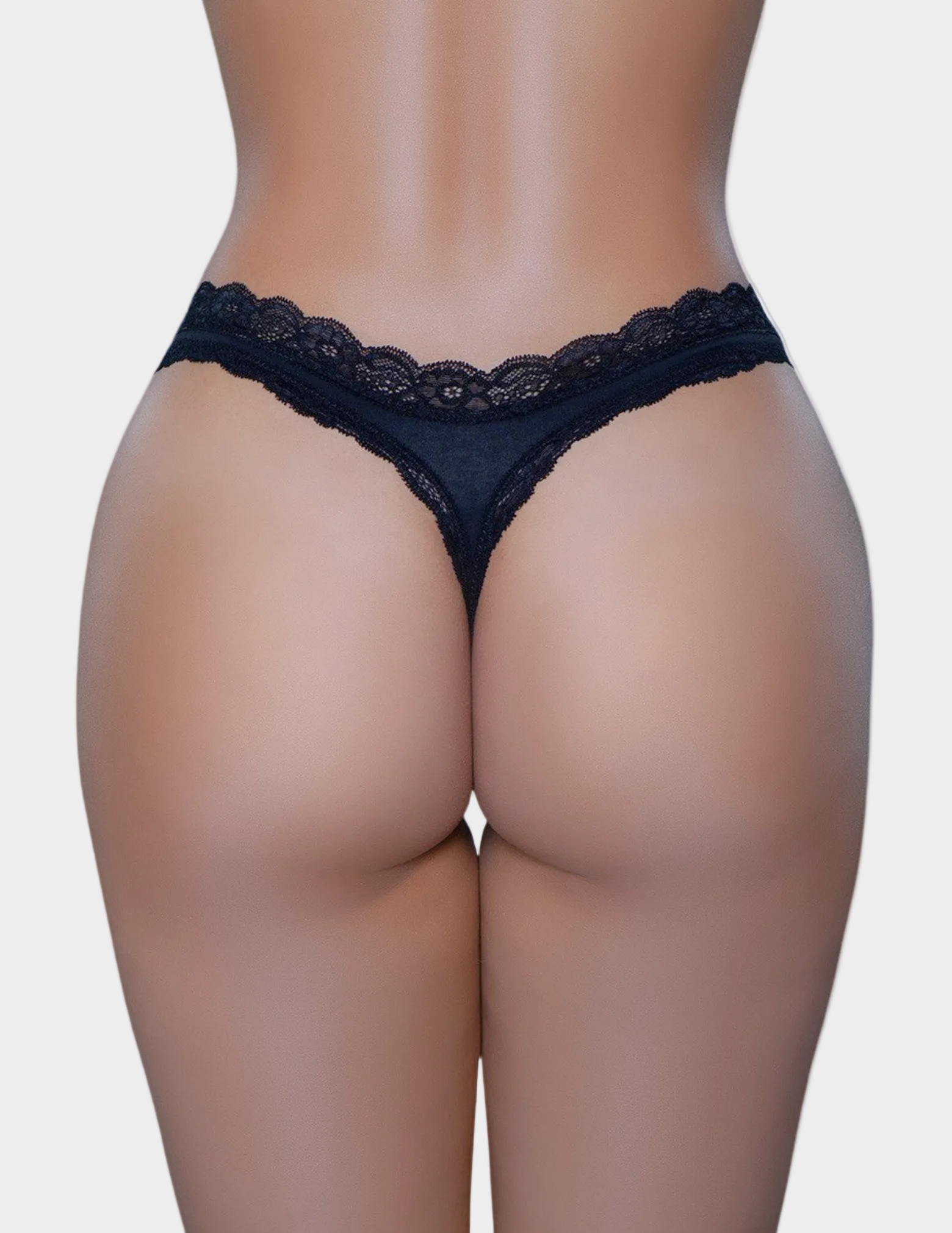 Back view of a model wearing a black thong with lace trim