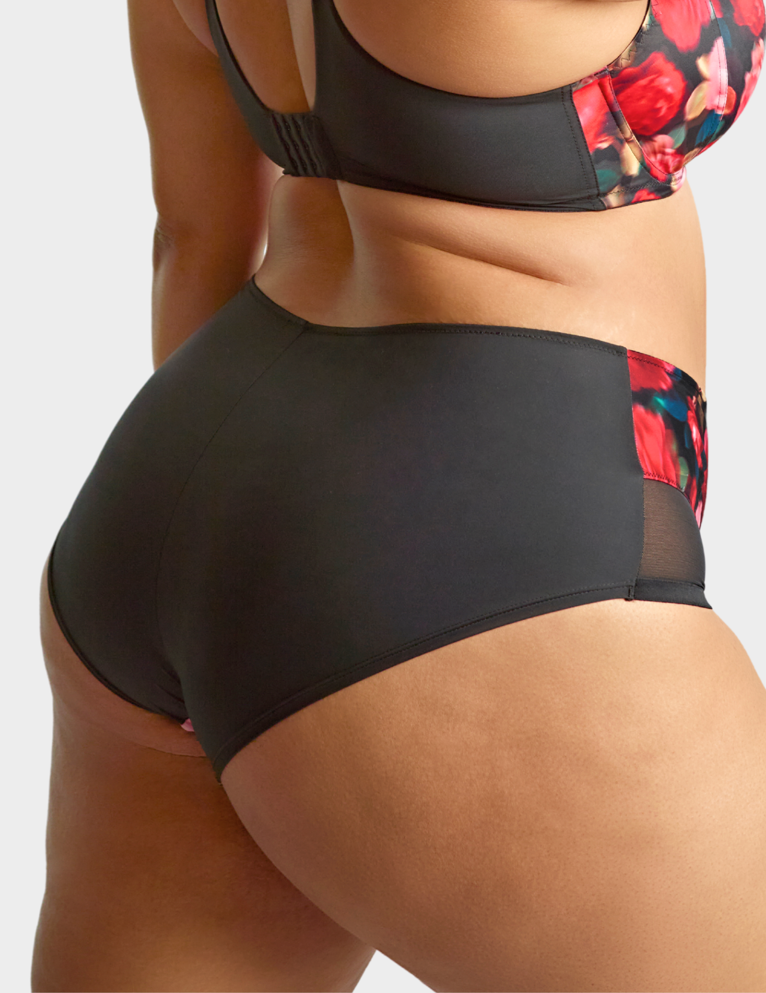 Side view of a model wearing Sculptresse Bliss brief in Rose Print